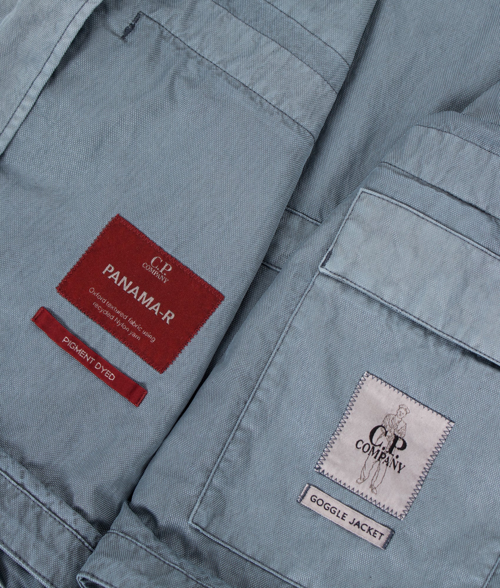 Panama-R Mixed Goggle Jacket in Silver Blue by C.P. Company. Shot by EQVVS. Internal Detail shot.