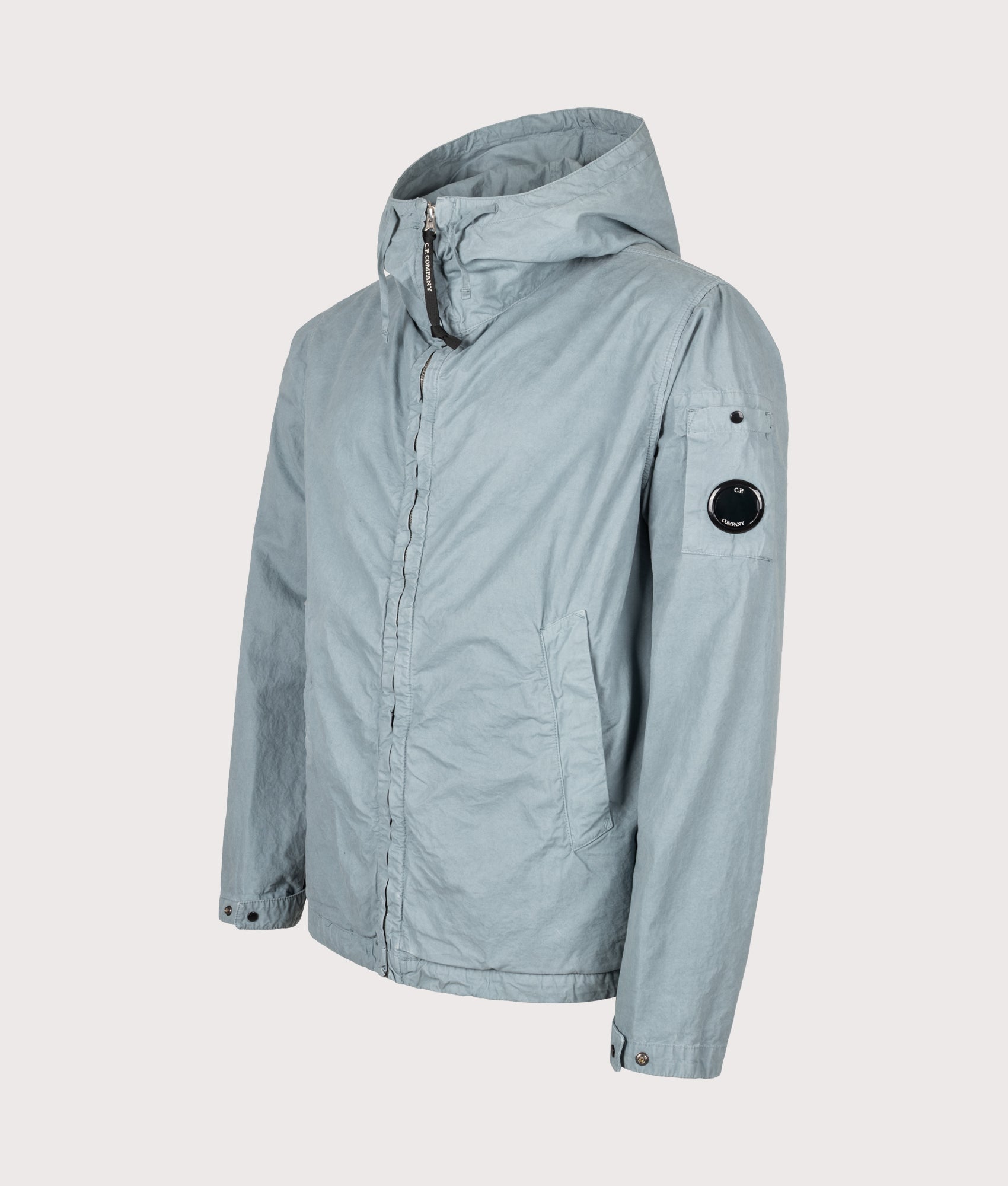 C.P. Company Micro-Reps Hooded Lens Jacket in Silver Blue at EQVVS Menswear. Angled front shot.