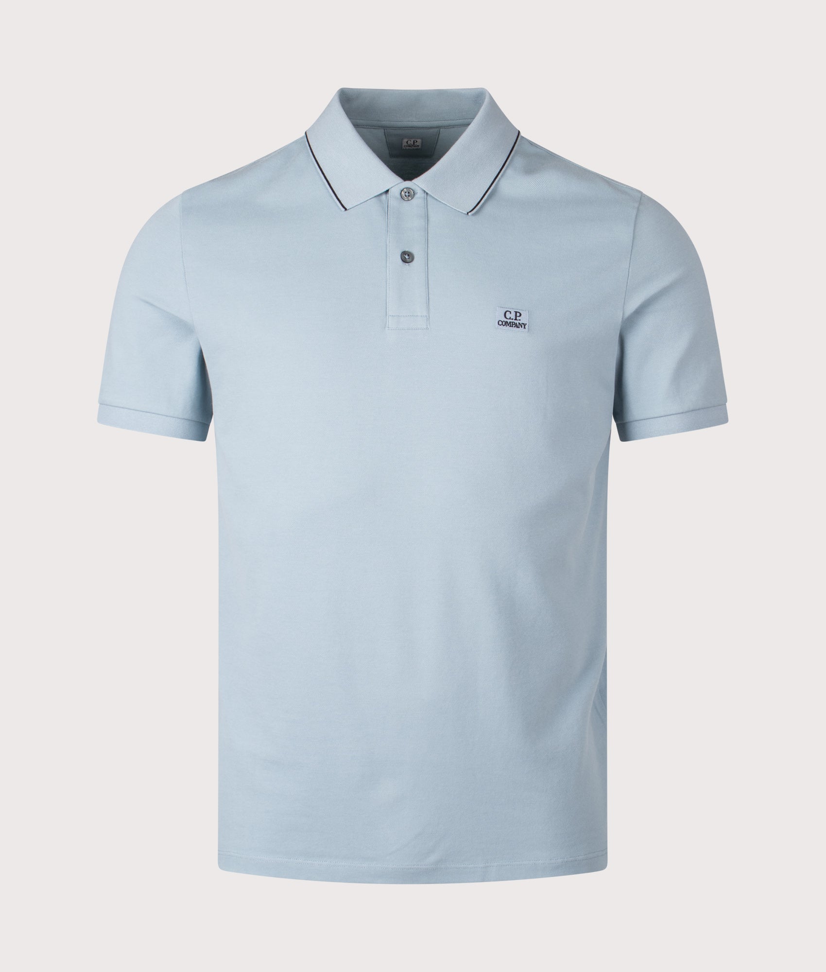 C.P. Company Stretch Piquet Short Sleeve Logo Polo Shirt in Silver Blue at EQVVS Menswear. Front shot.