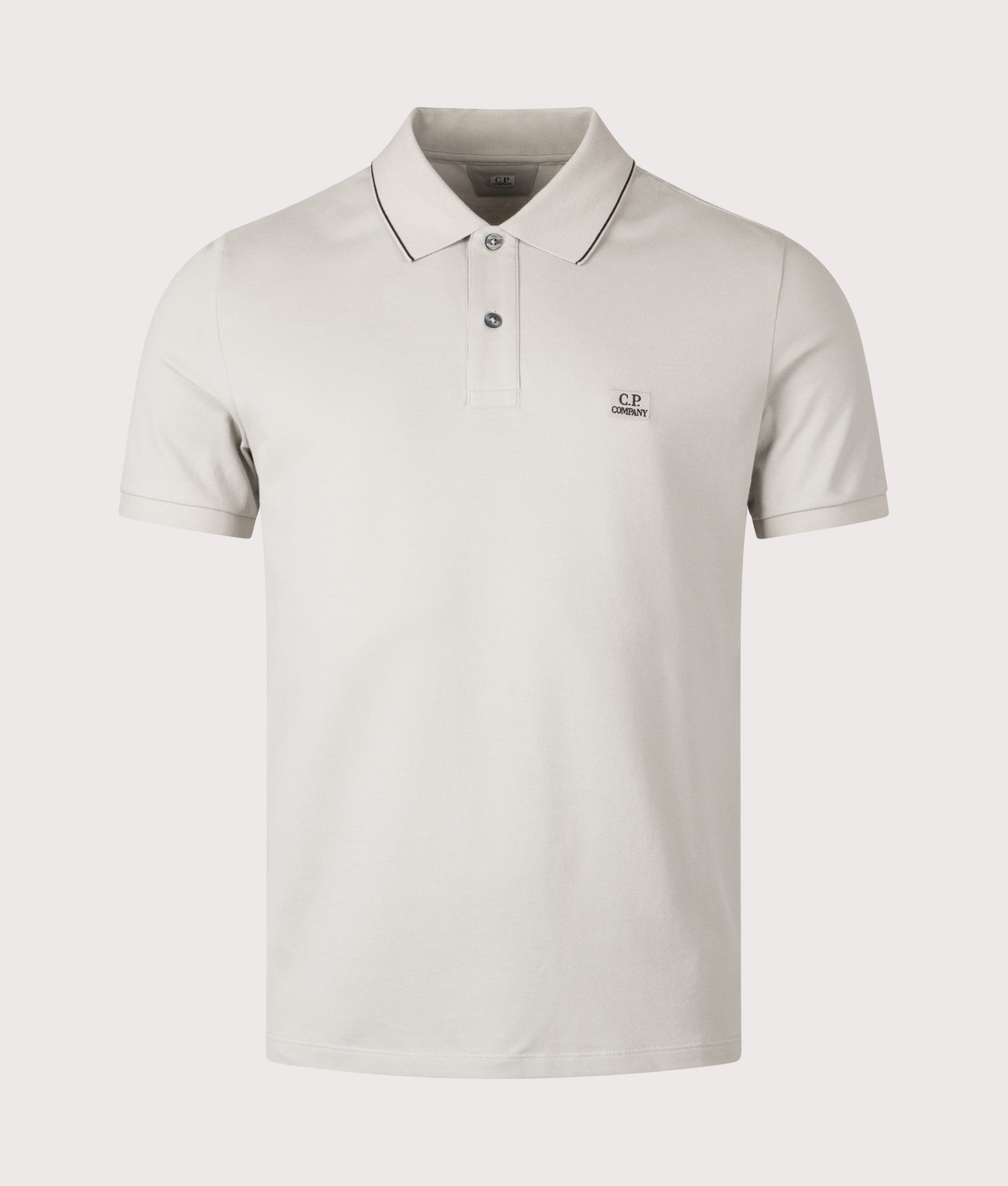 C.P. Company Stretch Piquet Short Sleeve Logo Polo Shirt in Dove at EQVVS Menswear. Front shot.