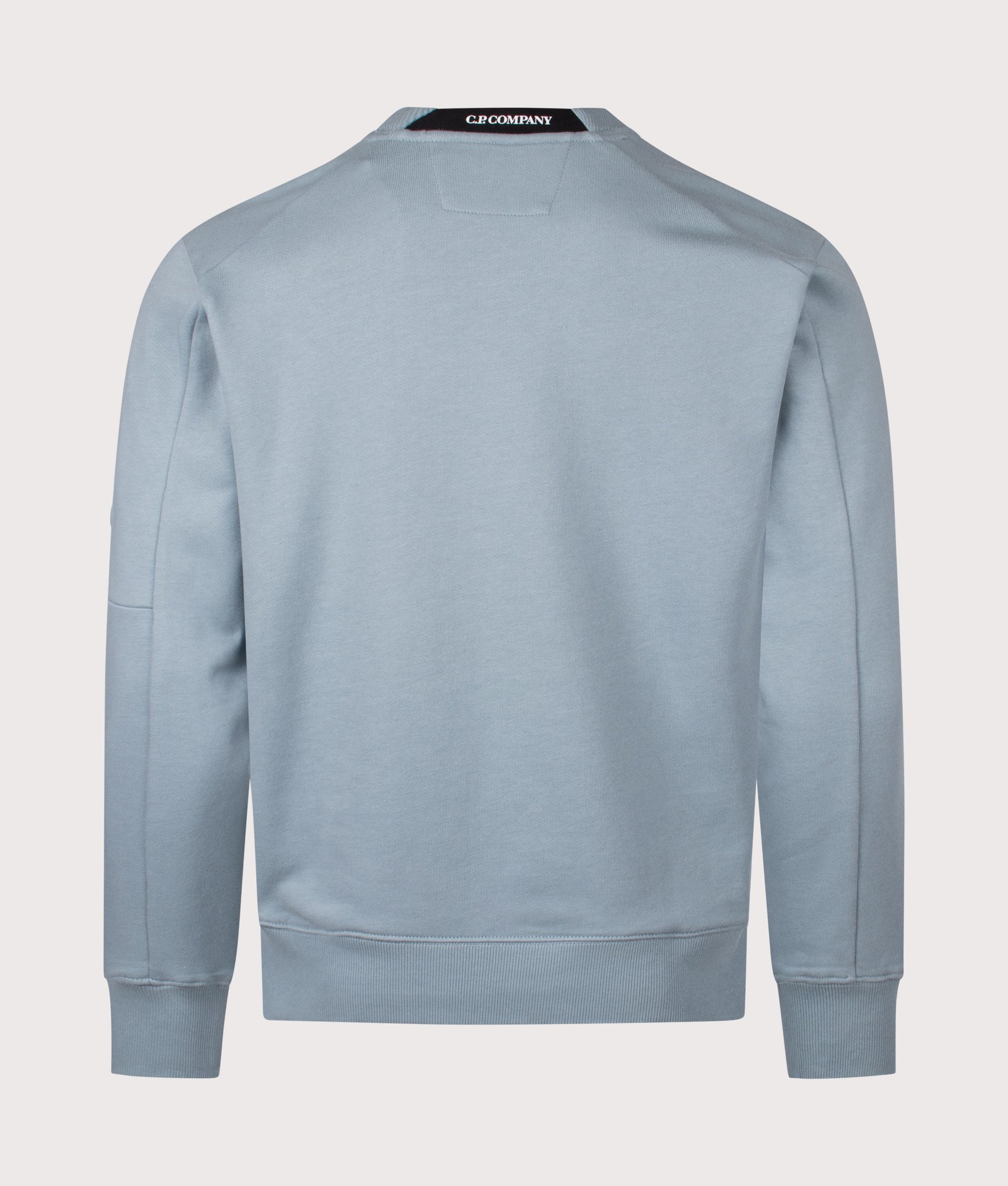 C.P. Company Diagonal Raised Fleece Lens Sweatshirt in Silver Blue at EQVVS Menswear. Back shot.