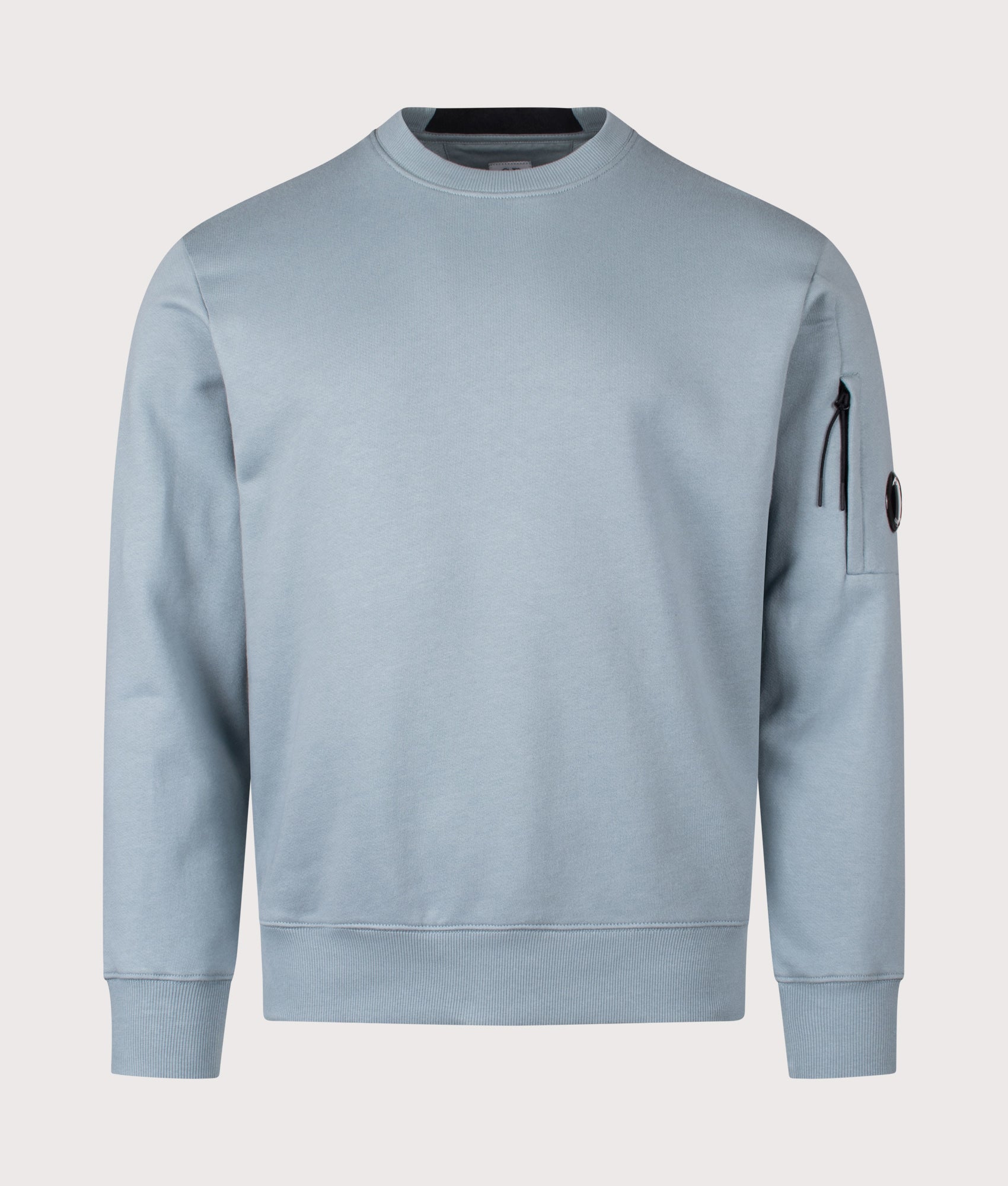 C.P. Company Diagonal Raised Fleece Lens Sweatshirt in Silver Blue at EQVVS Menswear. Front shot.