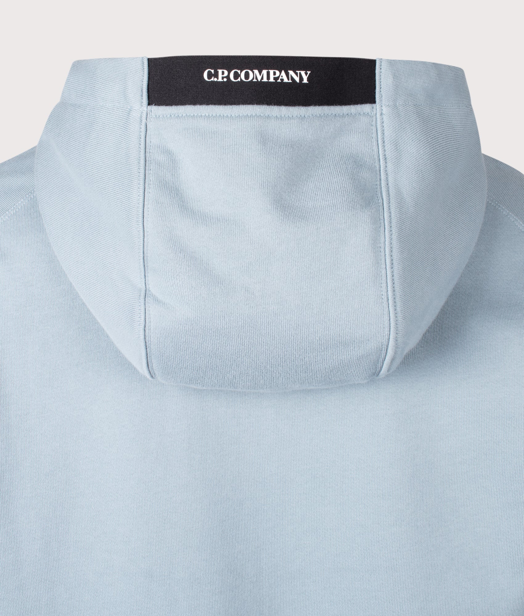 C.P. Company Diagonal Raised Fleece Lens Hoodie in Silver Blue at EQVVS Menswear. Back detail shot.