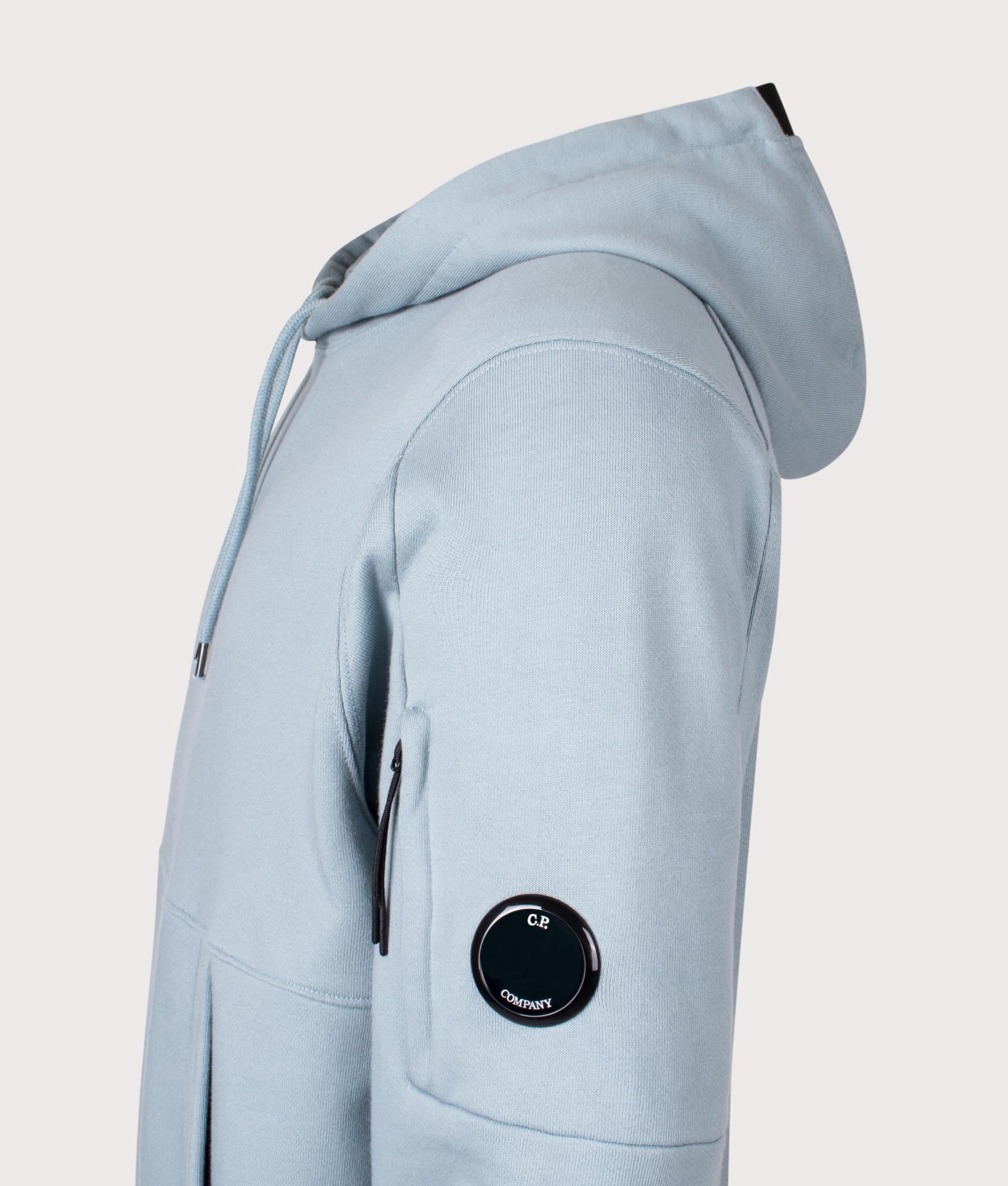 C.P. Company Diagonal Raised Fleece Lens Hoodie in Silver Blue at EQVVS Menswear. Detail shot.