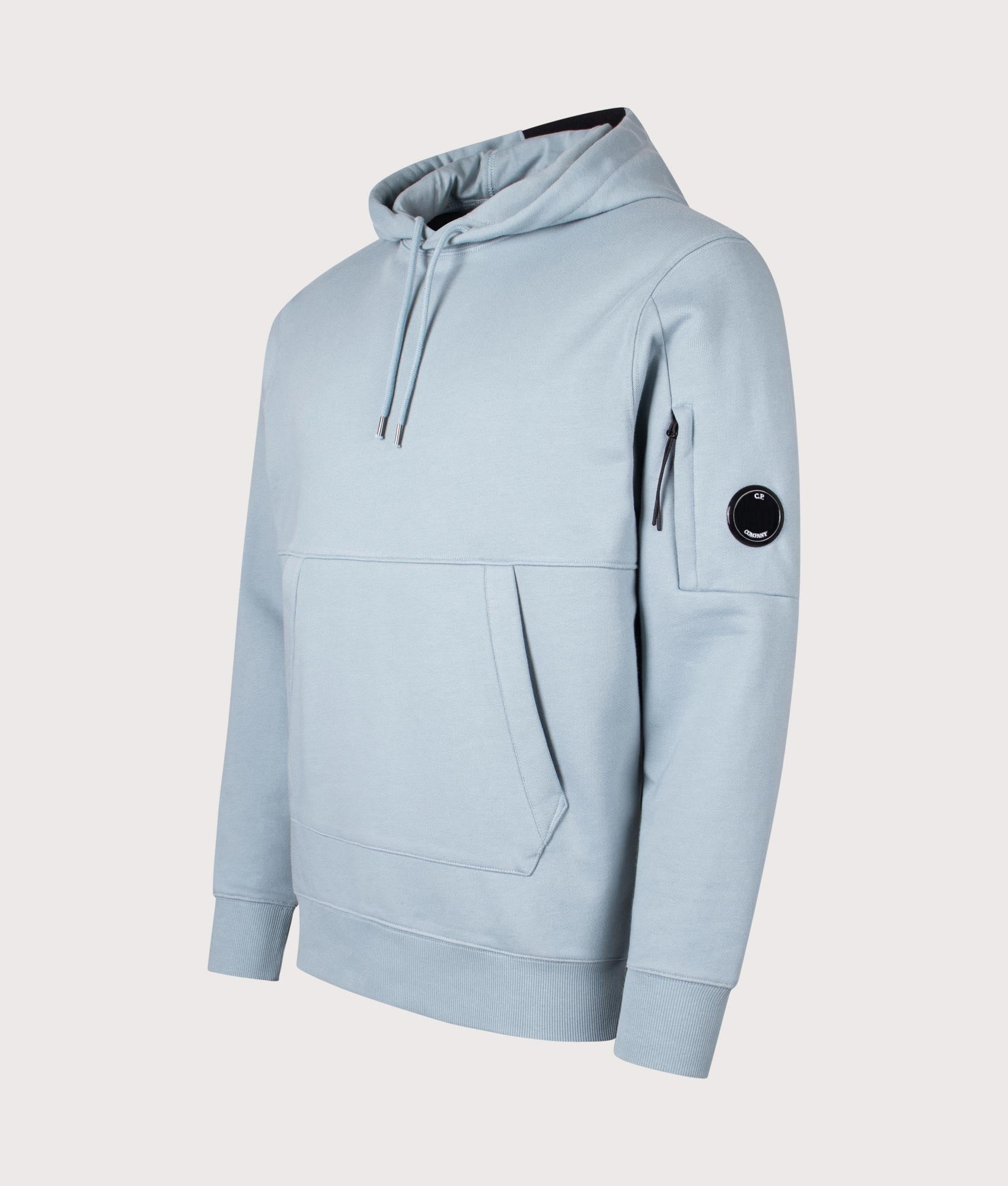 C.P. Company Diagonal Raised Fleece Lens Hoodie in Silver Blue at EQVVS Menswear. Angled front shot.