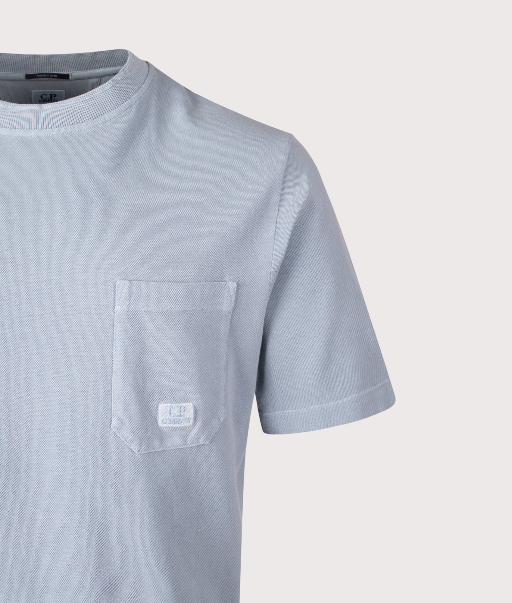 C.P. Company 24/1 Piquet Pigment Dyed Short Sleeve T-Shirt in Silver Blue at EQVVS Menswear. Detail shot.