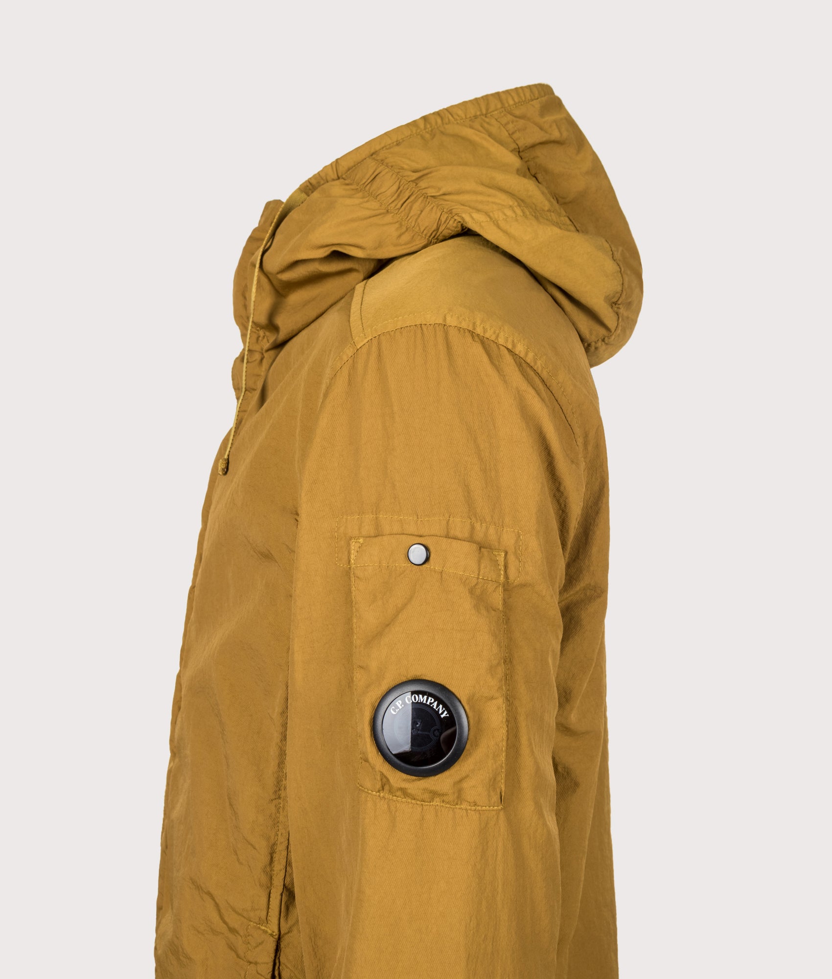 C.P. Company T-ST Nylon Hooded Lens Overshirt in Buck Thorn Brown at EQVVS Menswear. Detail shot.