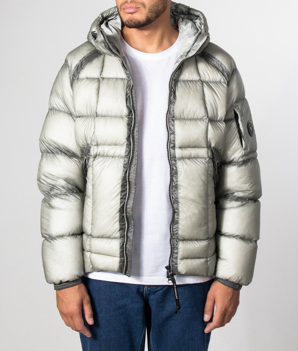 C.P. Company D.D. Shell Hooded Down Jacket in Flint Grey at EQVVS Menswear. Model front shot.