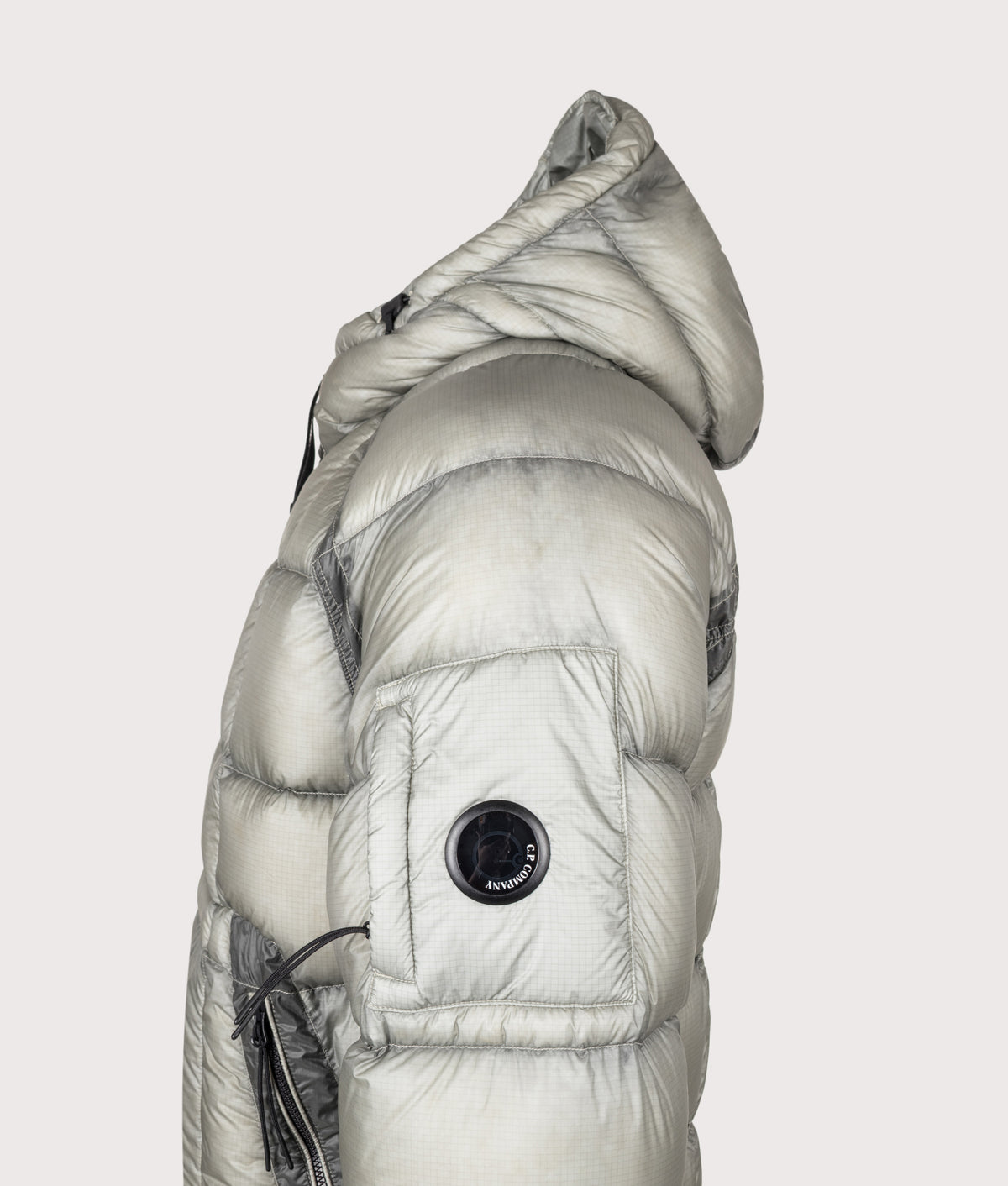 C.P. Company D.D. Shell Hooded Down Jacket in Flint Grey at EQVVS Menswear. Detail shot.