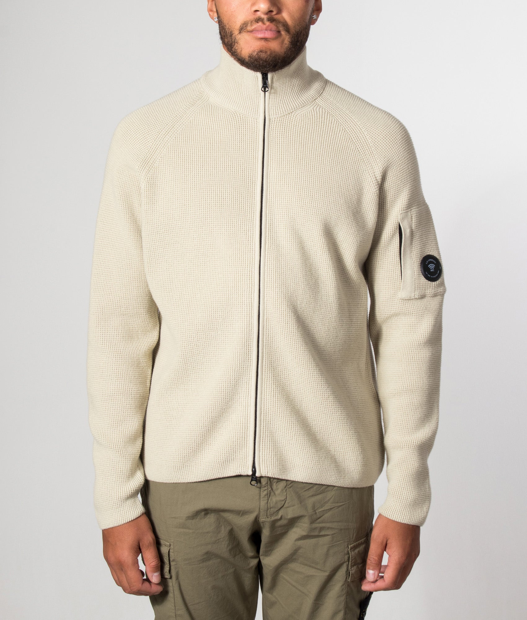 C.P. Company Waffle Knit Zip Through Lens Cardigan in Silver Birch at EQVVS Menswear. Model front shot.