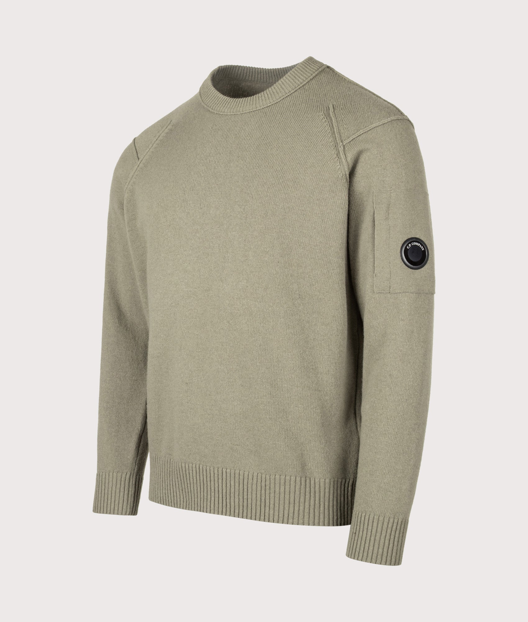 C.P. Company Lambswool GRS Crewneck Lens Jumper in Fallen Rock at EQVVS Menswear. Angled front shot.