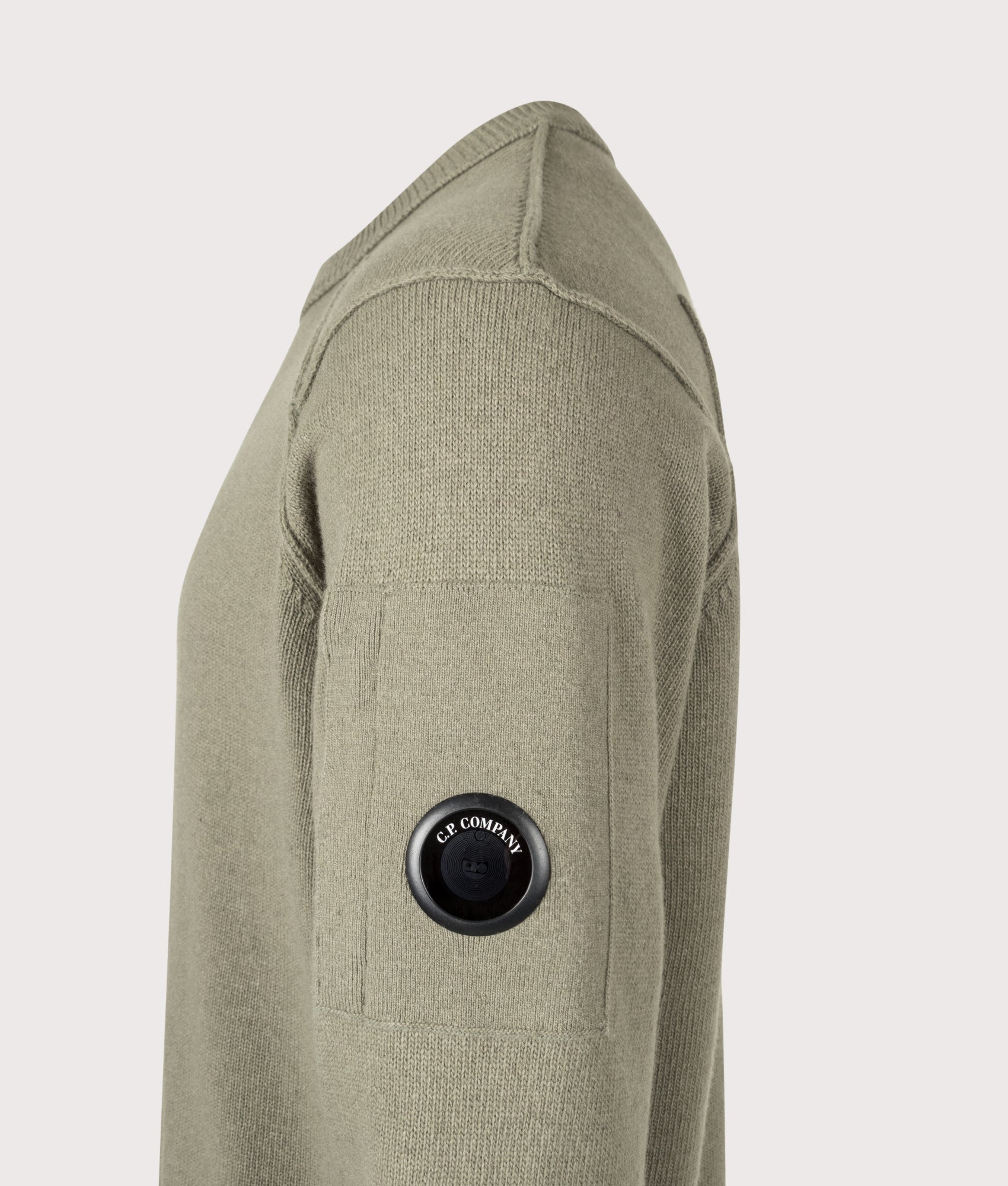 C.P. Company Lambswool GRS Crewneck Lens Jumper in Fallen Rock at EQVVS Menswear. Detail shot.