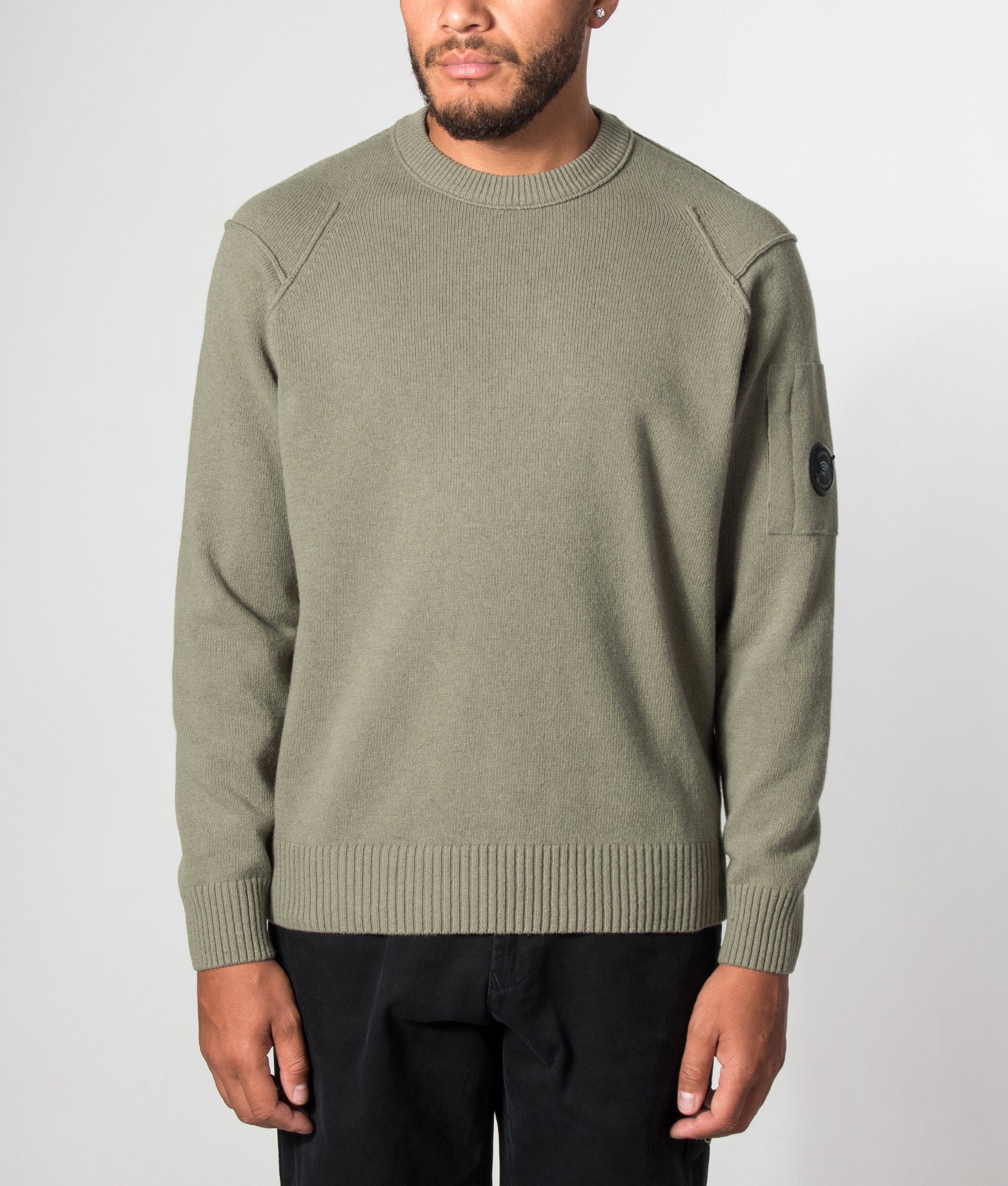 C.P. Company Lambswool GRS Crewneck Lens Jumper in Fallen Rock at EQVVS Menswear. Model front shot.
