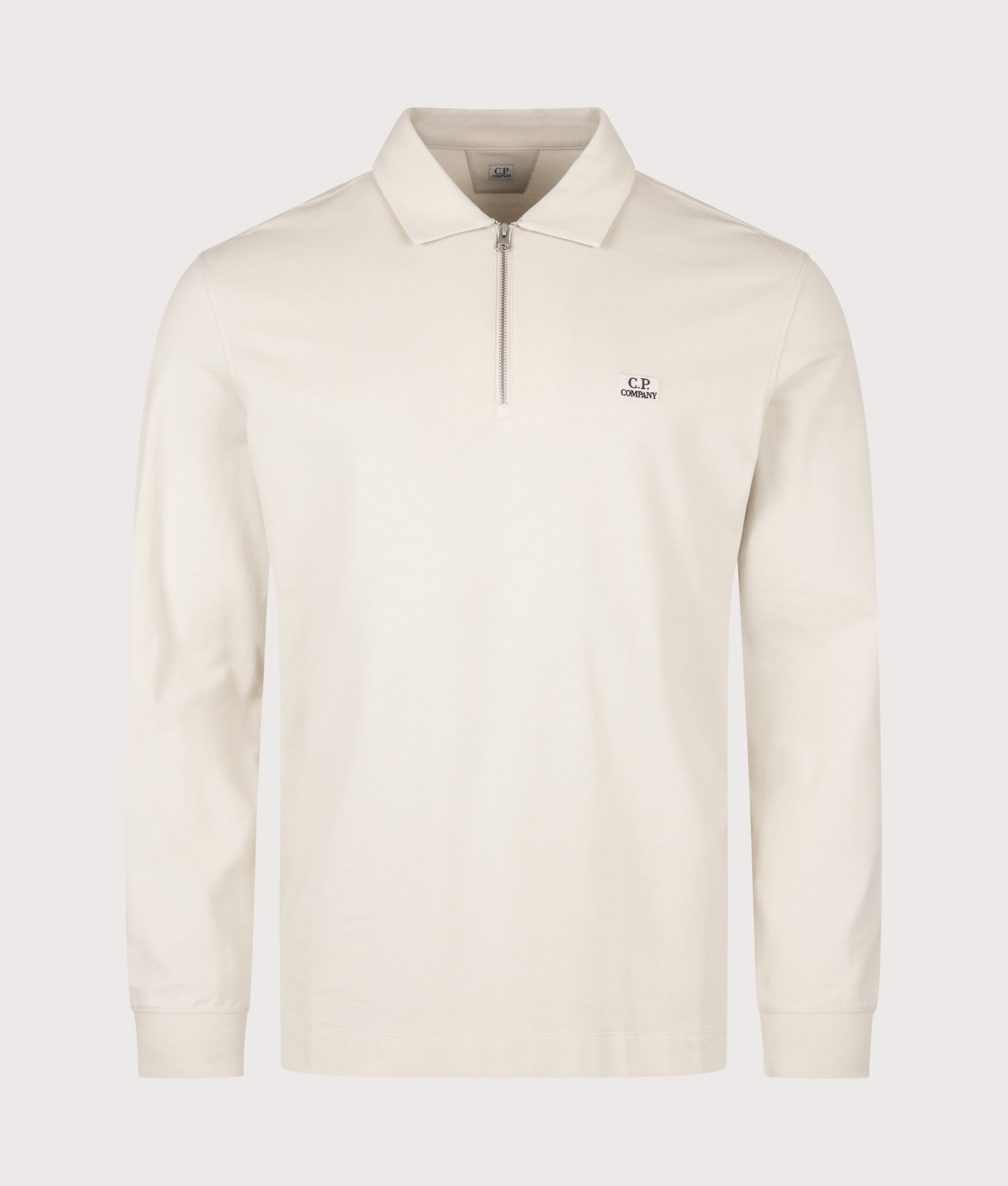 C.P. Company Long Sleeve Stretch Piquet Zip Polo Shirt in Silver Birch at EQVVS Menswear. Front shot.