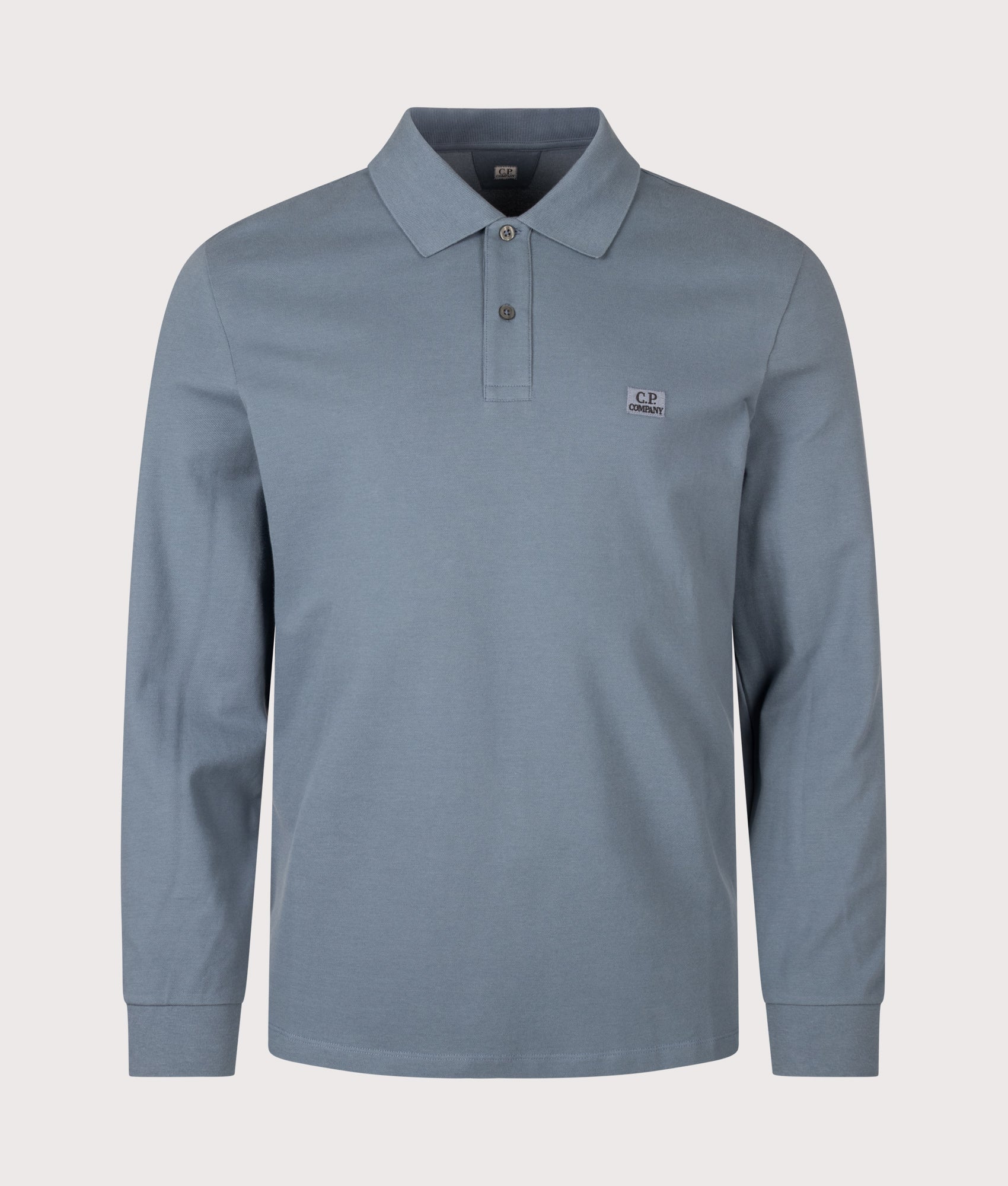 C.P. Company Long Sleeve Stretch Piquet Logo Polo Shirt in Orion Blue at EQVVS Menswear. Front shot.