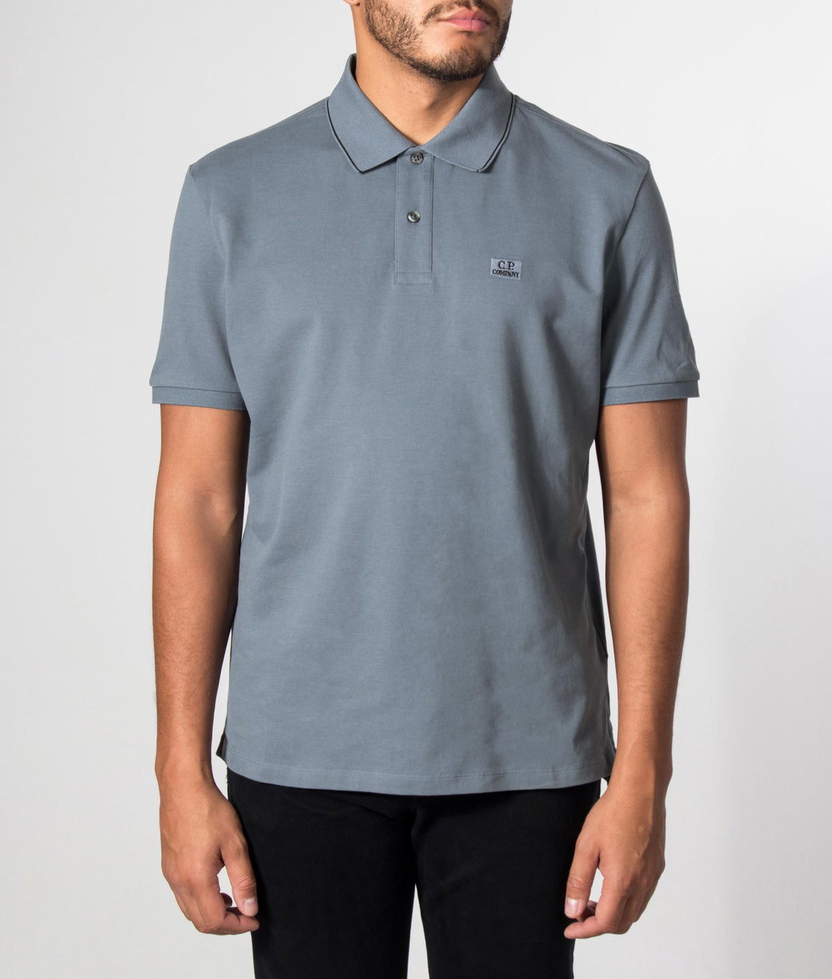 C.P. Company Regular Fit Stretch Piquet Striped Collar Polo Shirt in Orion Blue at EQVVS Menswear. Model front shot.