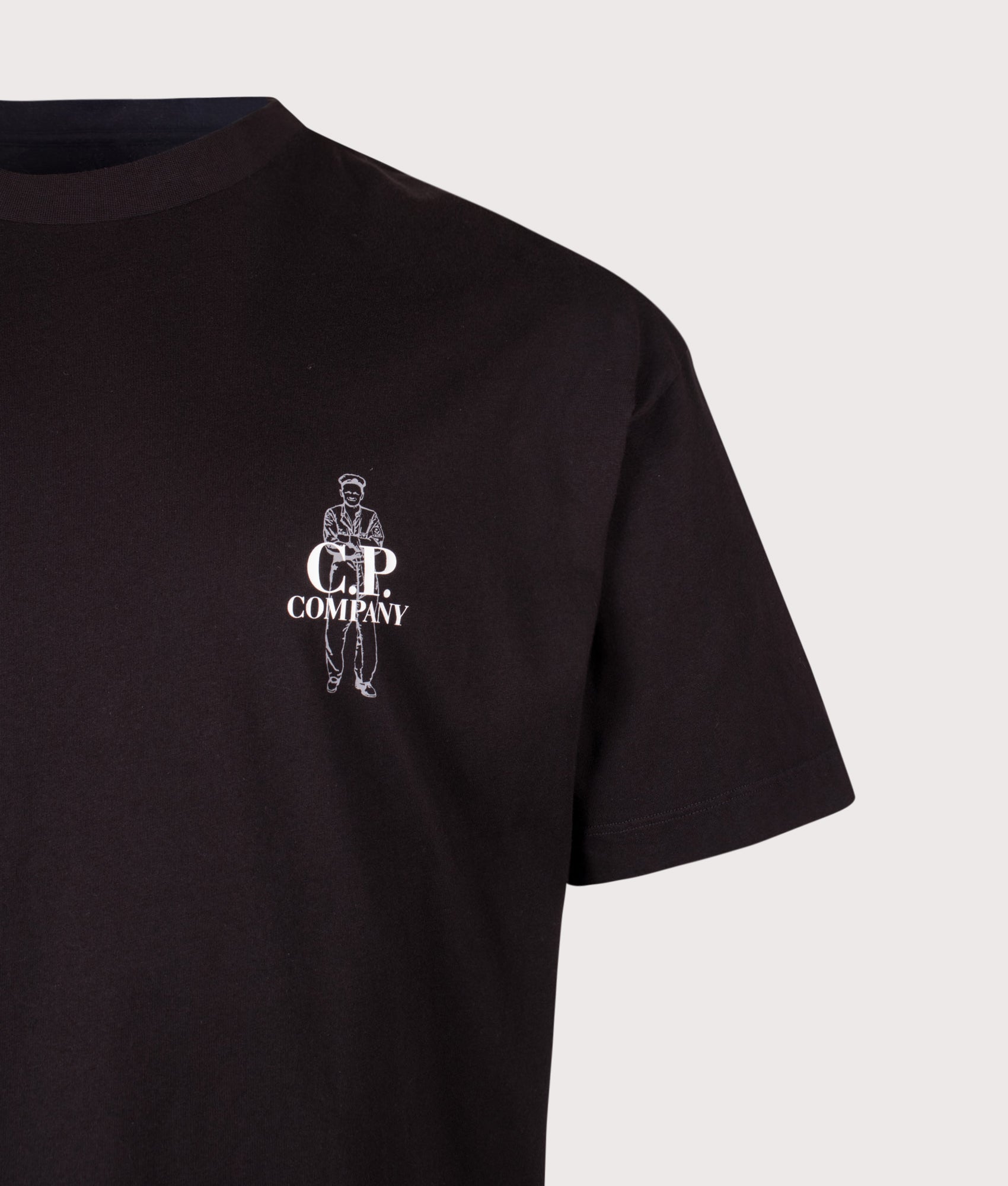 C.P. Company Comfort Fit 30/1 Jersey Logo T-Shirt in Black at EQVVS Menswear. Detail shot.