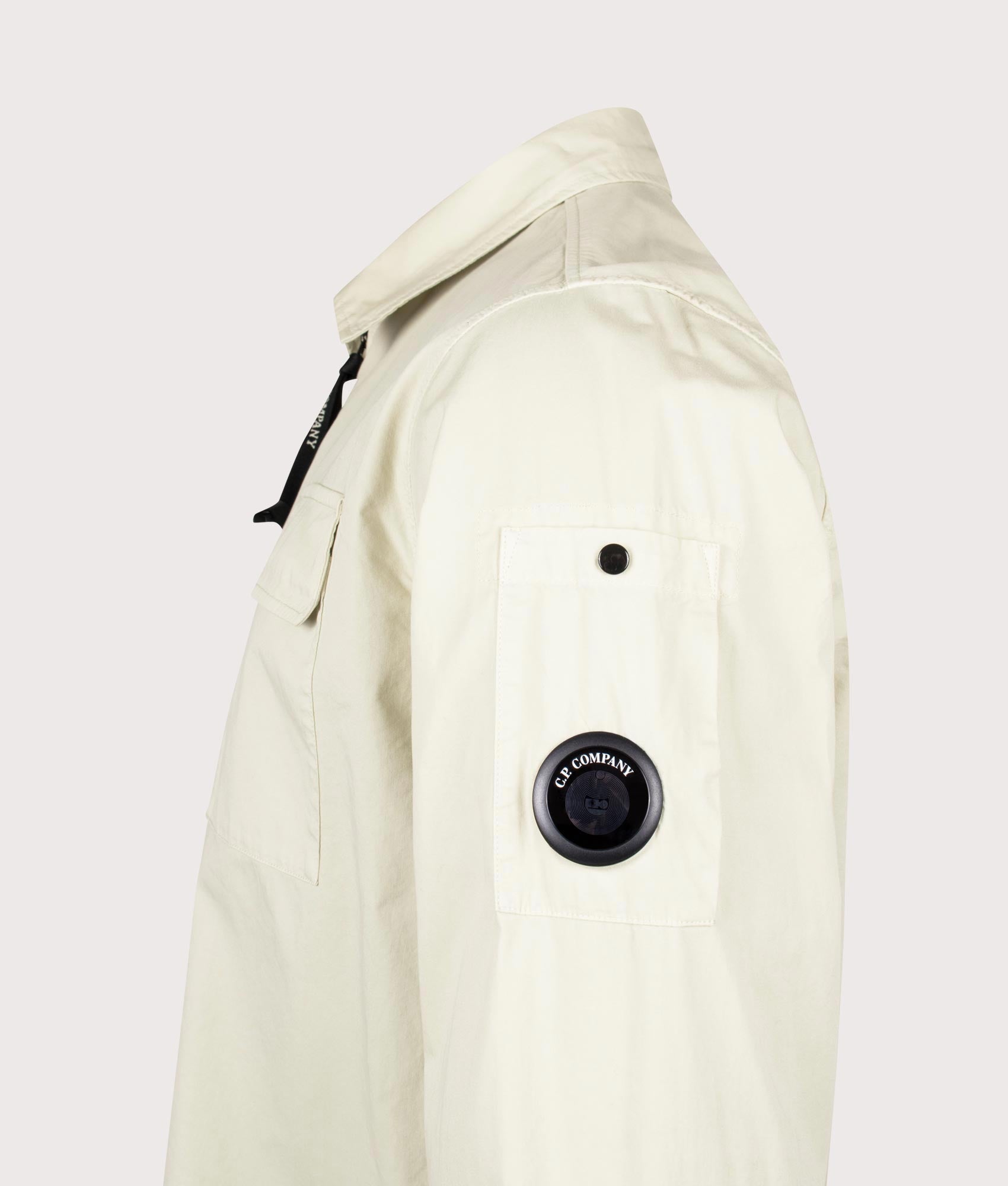 C.P. Company Organic Gabardine Zipped Lens Overshirt in Silver Birch at EQVVS Menswear. Detail shot.