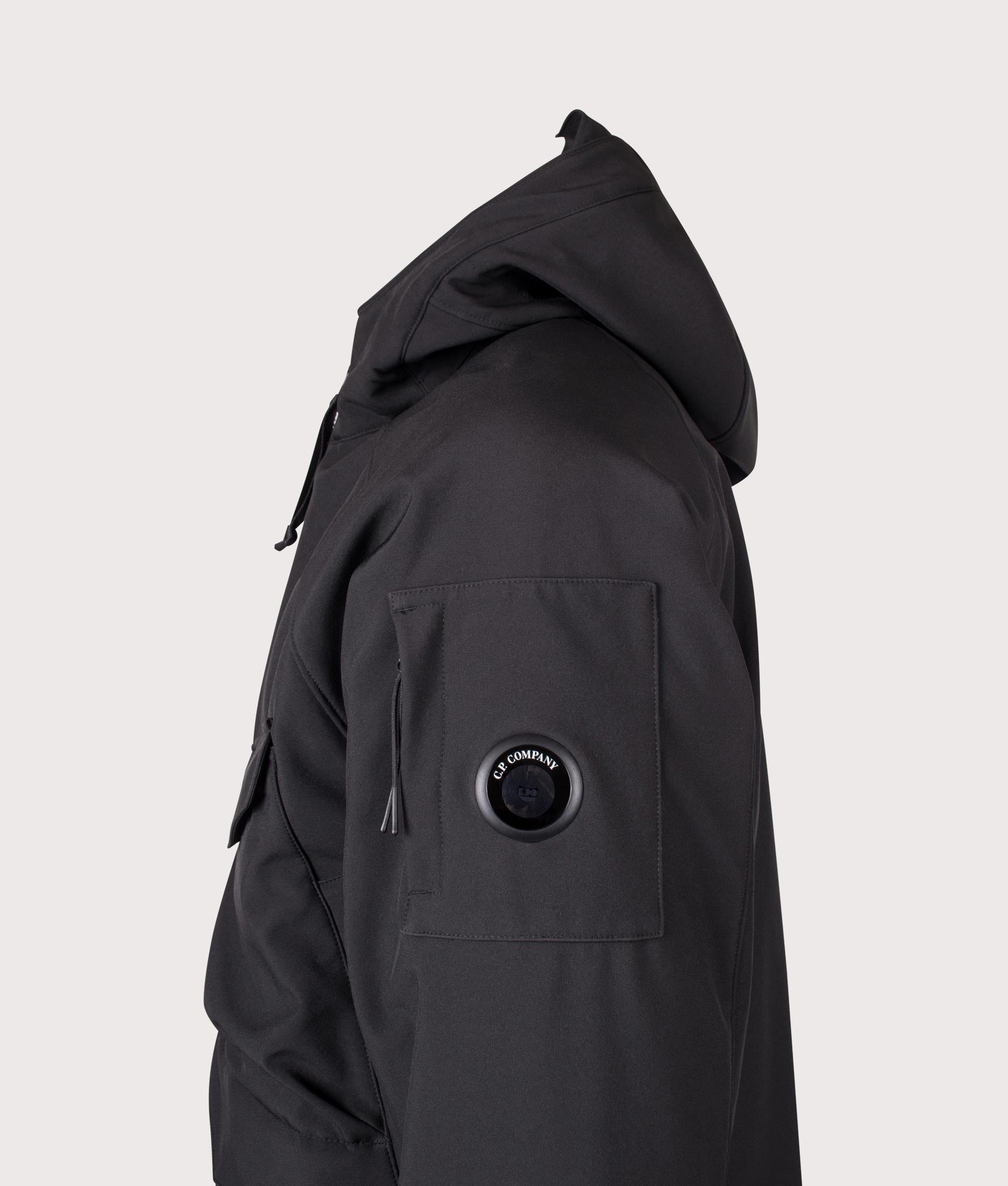 C.P. Company C.P. Shell-R Padded Hooded Lens Jacket in Black at EQVVS Menswear. Detail shot.