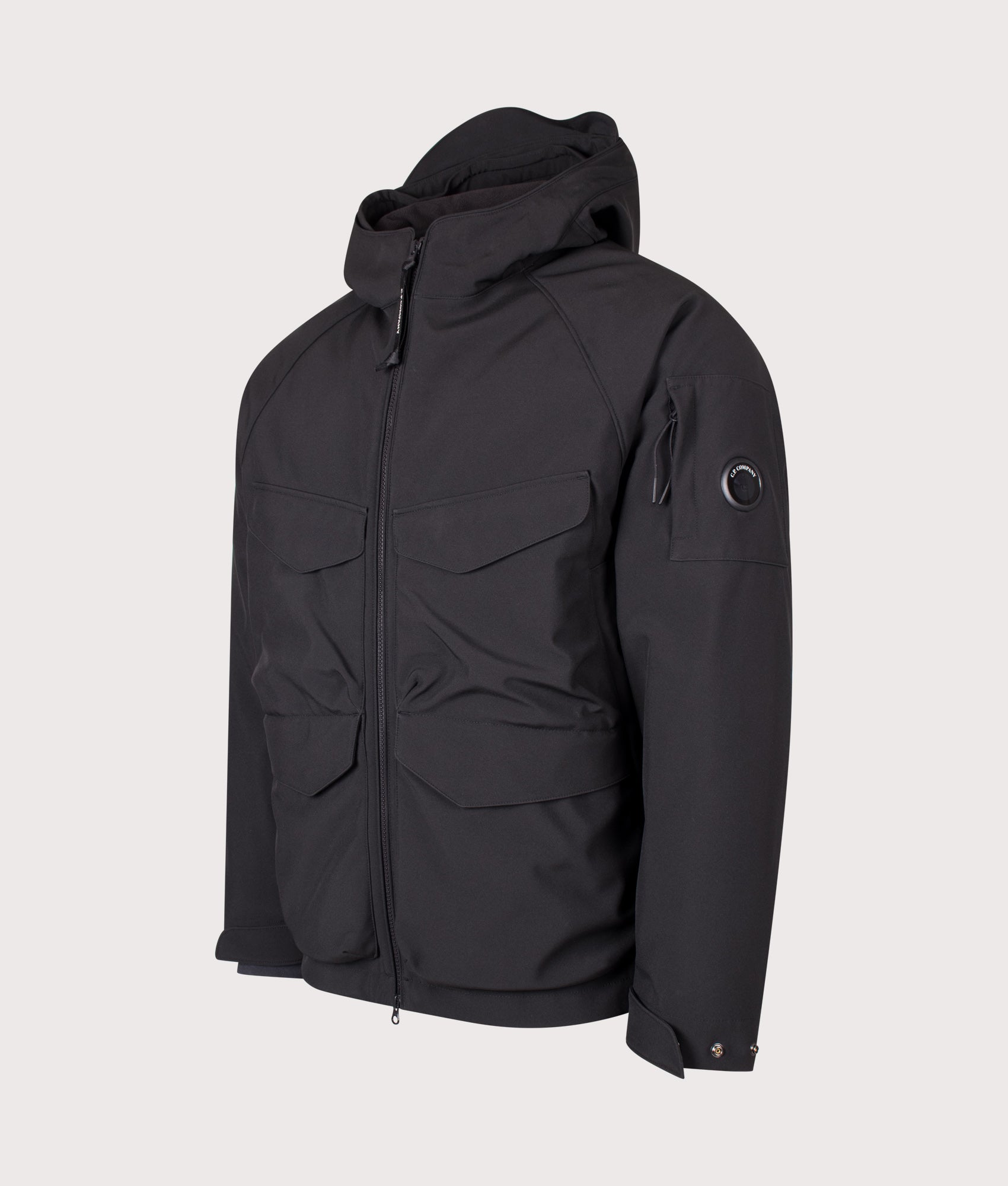 C.P. Company C.P. Shell-R Padded Hooded Lens Jacket in Black at EQVVS Menswear. Angled front shot.