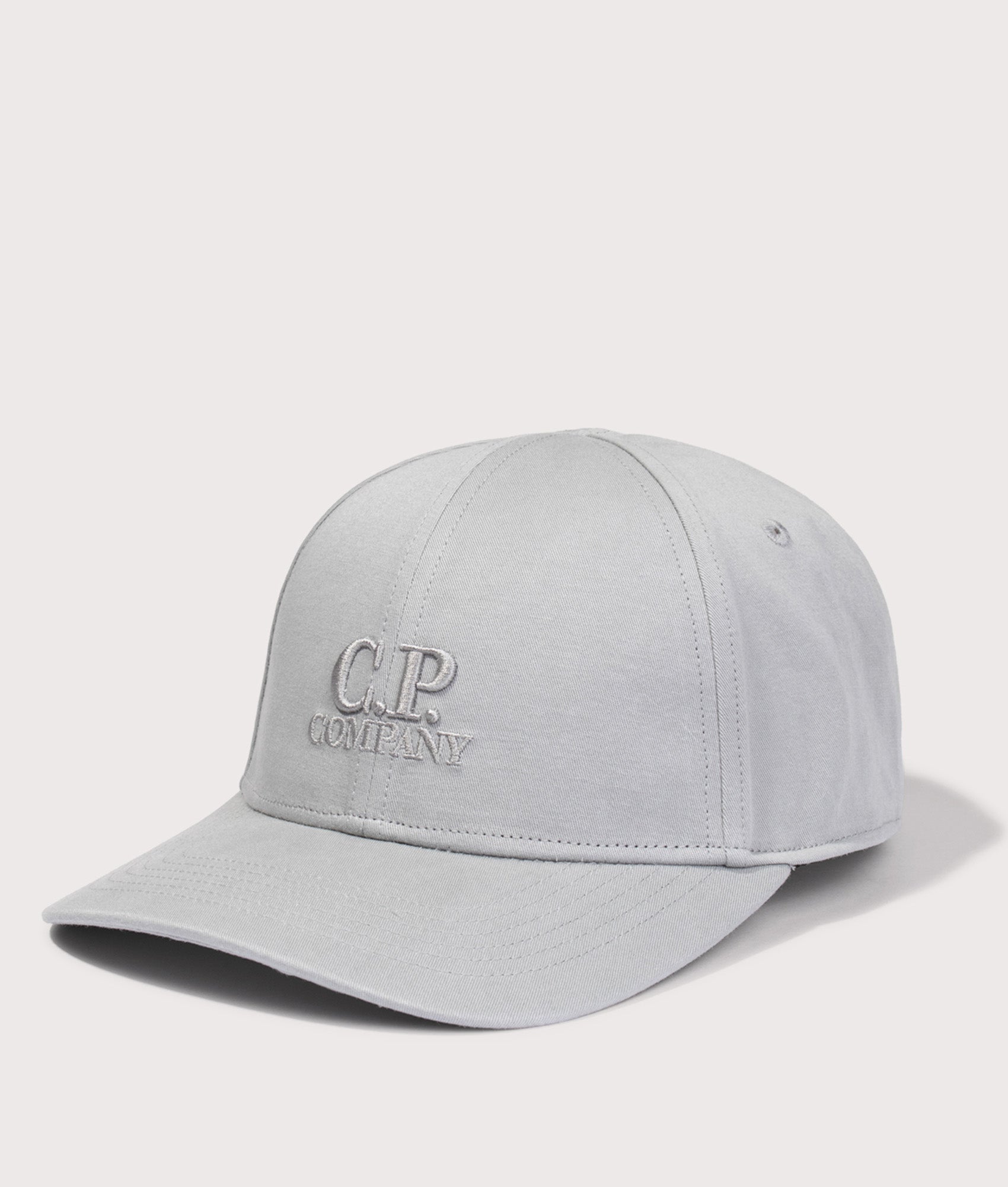 C.P. Company Gabardine Logo Cap in Flint Grey at EQVVS Menswear. Angled front shot.