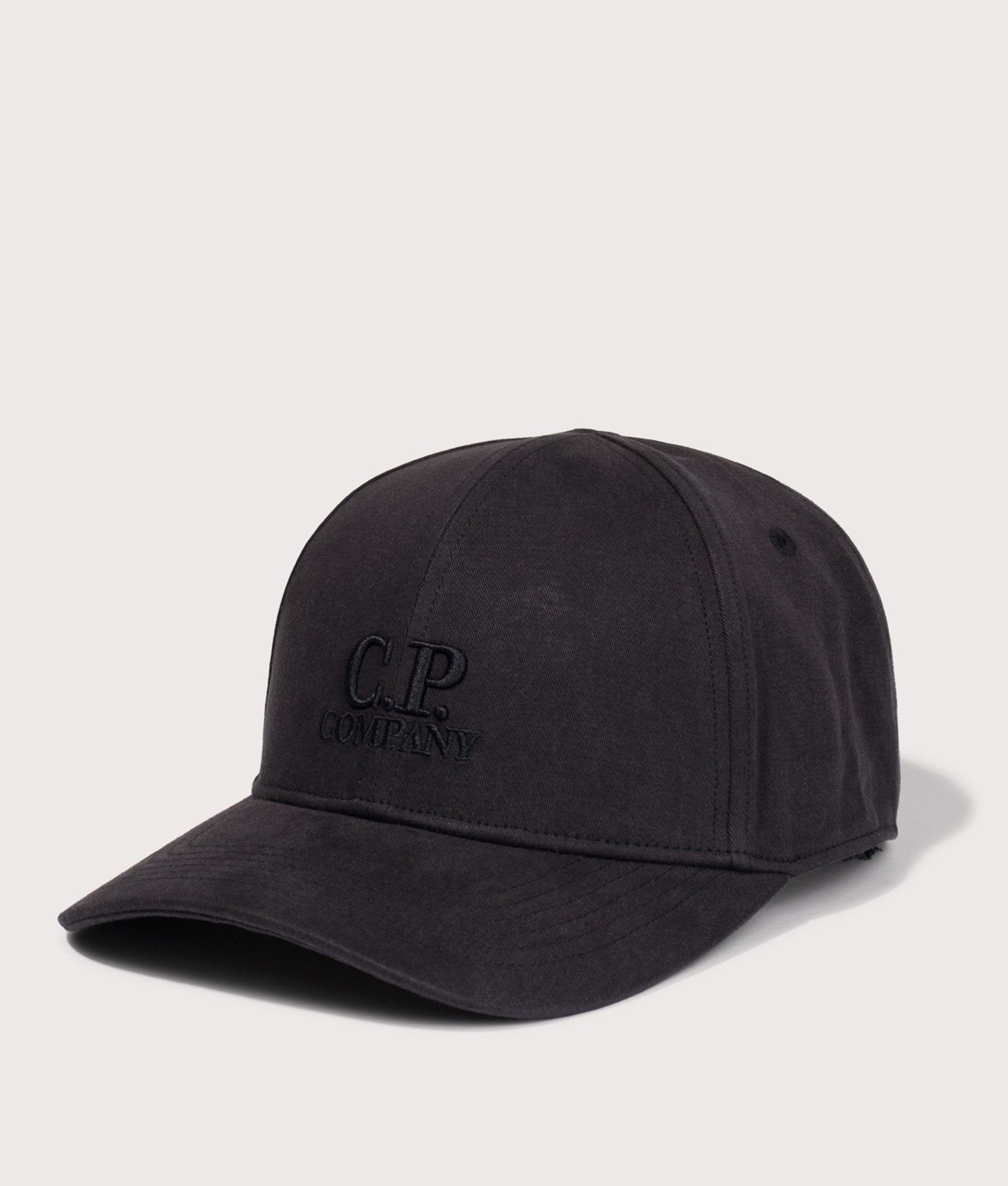 C.P. Company  Gabardine Logo Cap in Black at EQVVS Menswear. Angled front shot.