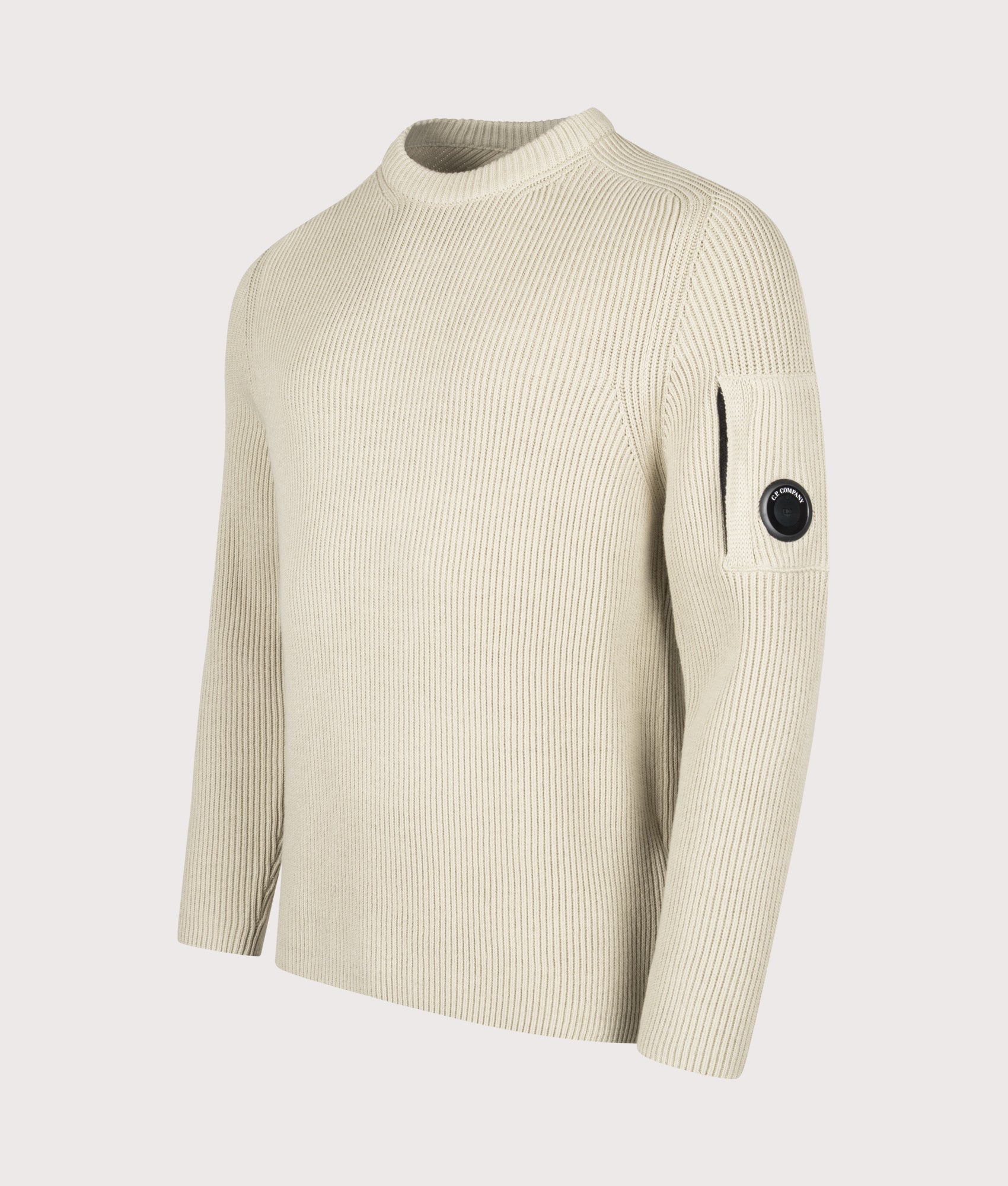 C.P. Company Full Rib Cotton Crewneck Lens Jumper in Silver Birch at EQVVS Menswear. Angled front shot.
