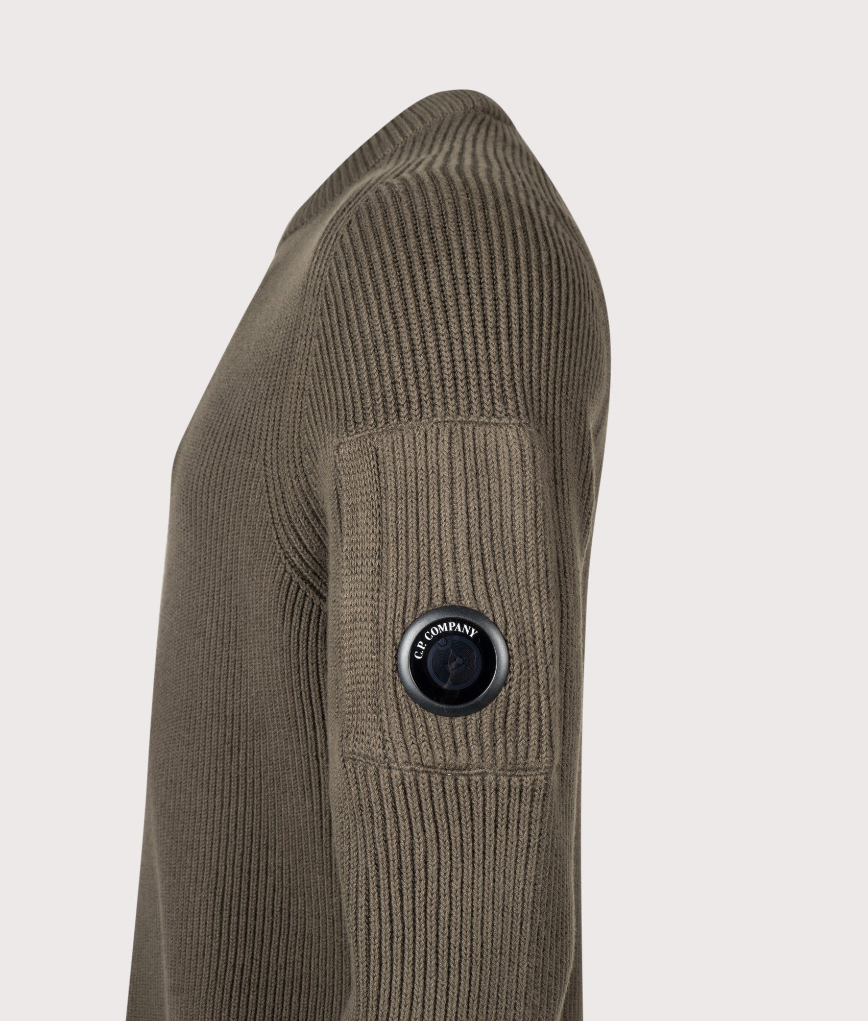 C.P. Company Full Rib Cotton Crewneck Lens Jumper in Ivy Green at EQVVS Menswear. Detail shot.