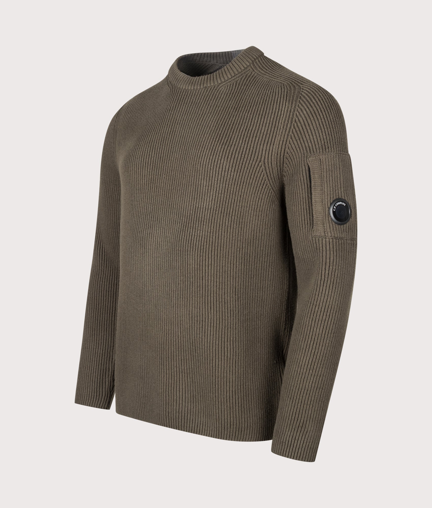 C.P. Company Full Rib Cotton Crewneck Lens Jumper in Ivy Green at EQVVS Menswear. Angled front shot.