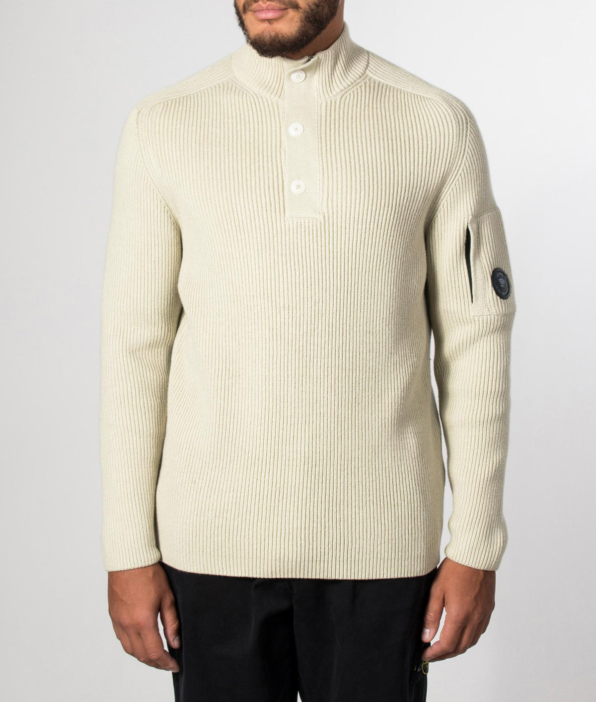 C.P. Company Full Rib Cotton Half Button Lens Jumper in Silver Birch at EQVVS Menswear. Model front shot.