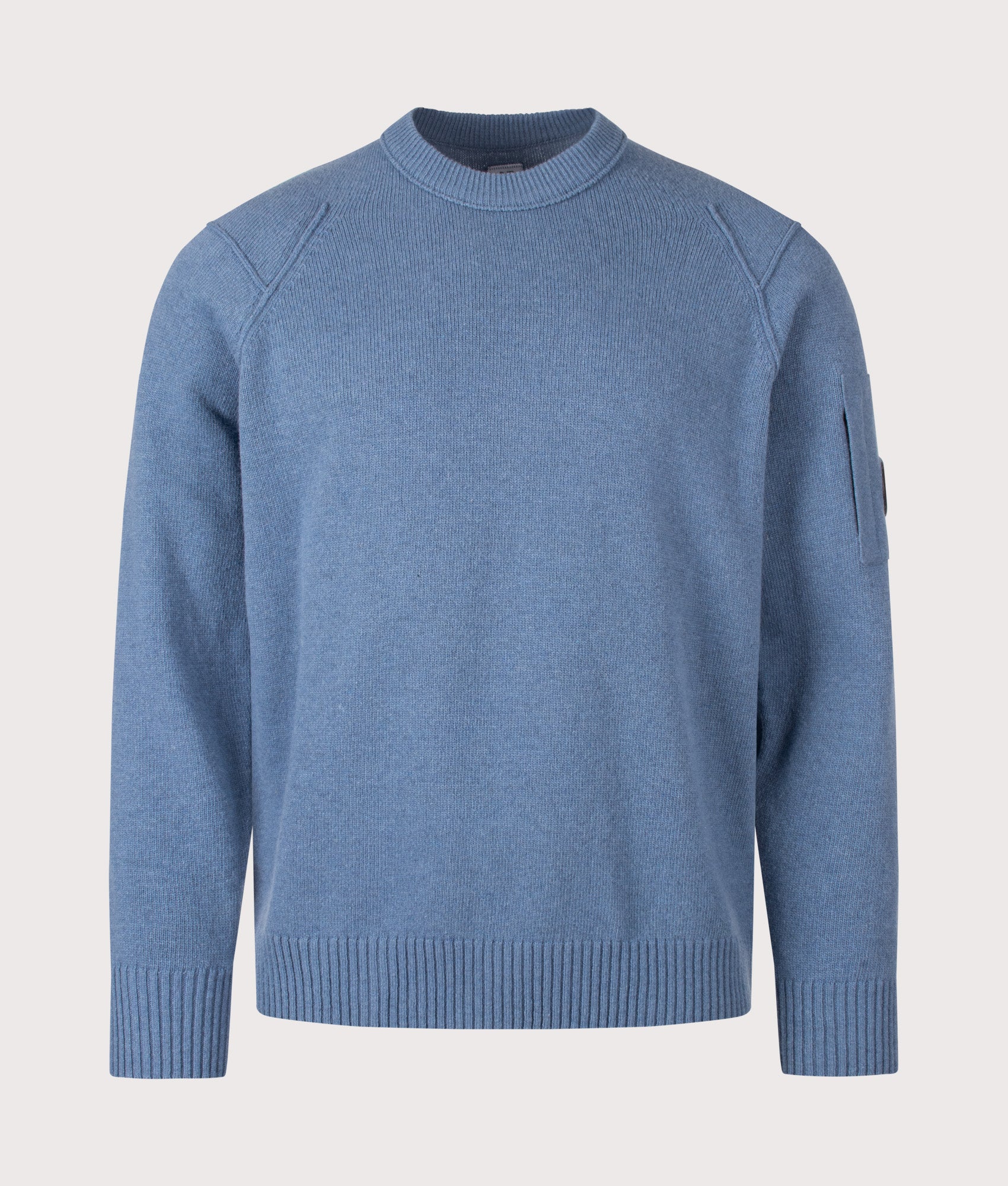 C.P. Company Lambswool GRS Crewneck Lens Jumper in Orion Blue at EQVVS Menswear. Front shot.
