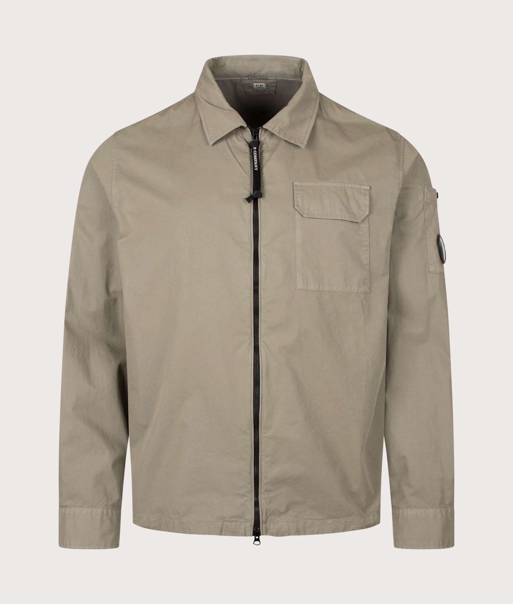 C.P. Company Organic Gabardine Zipped Lens Overshirt in Fallen Rock at EQVVS Menswear. Front shot.