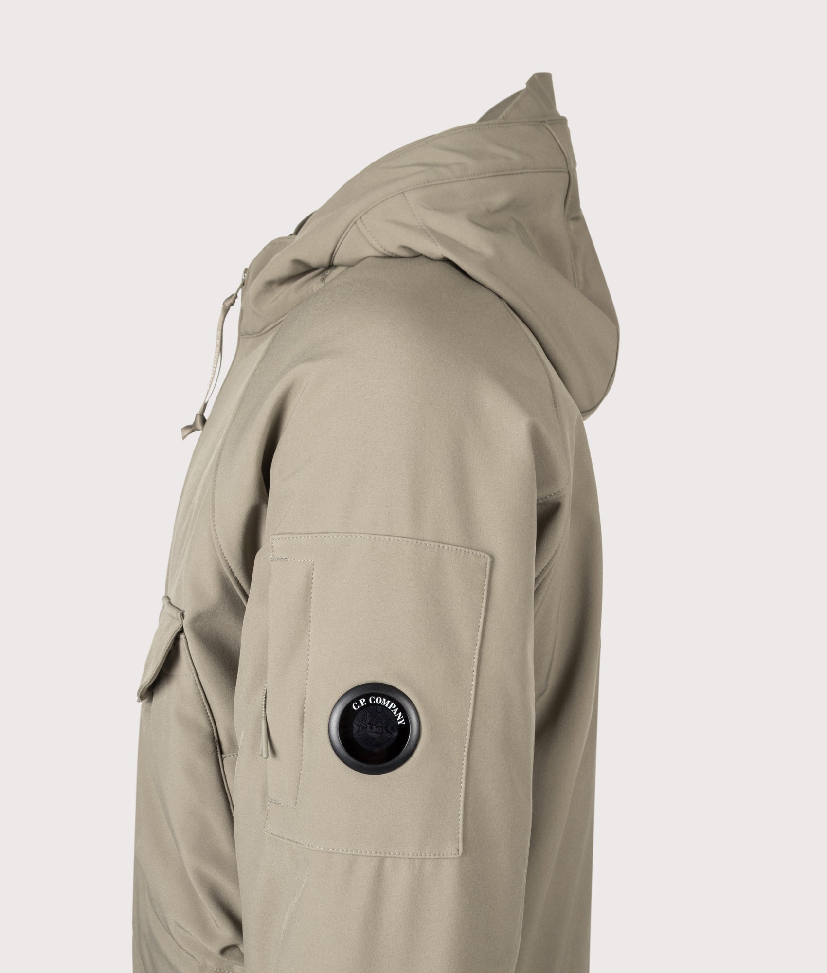 C.P. Company C.P. Shell-R Padded Hooded Lens Jacket in Fallen Rock at EQVVS Menswear. Detail shot.