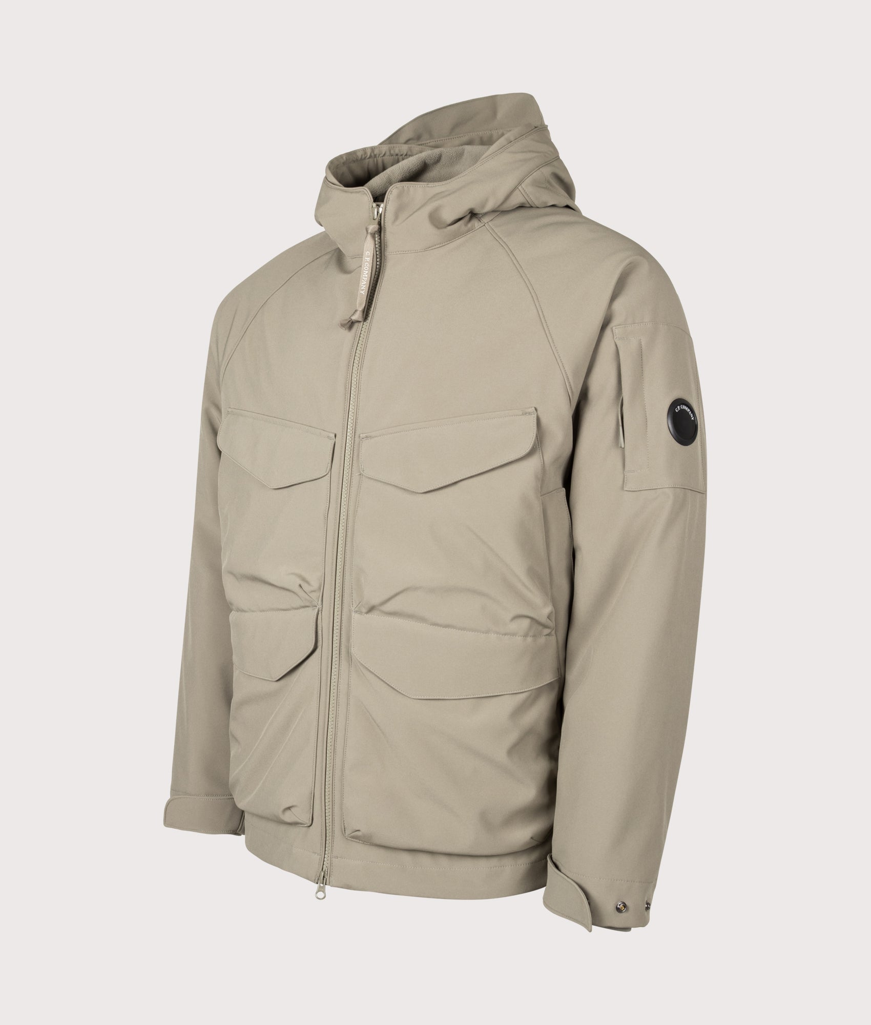 C.P. Company C.P. Shell-R Padded Hooded Lens Jacket in Fallen Rock at EQVVS Menswear. Angled front shot.