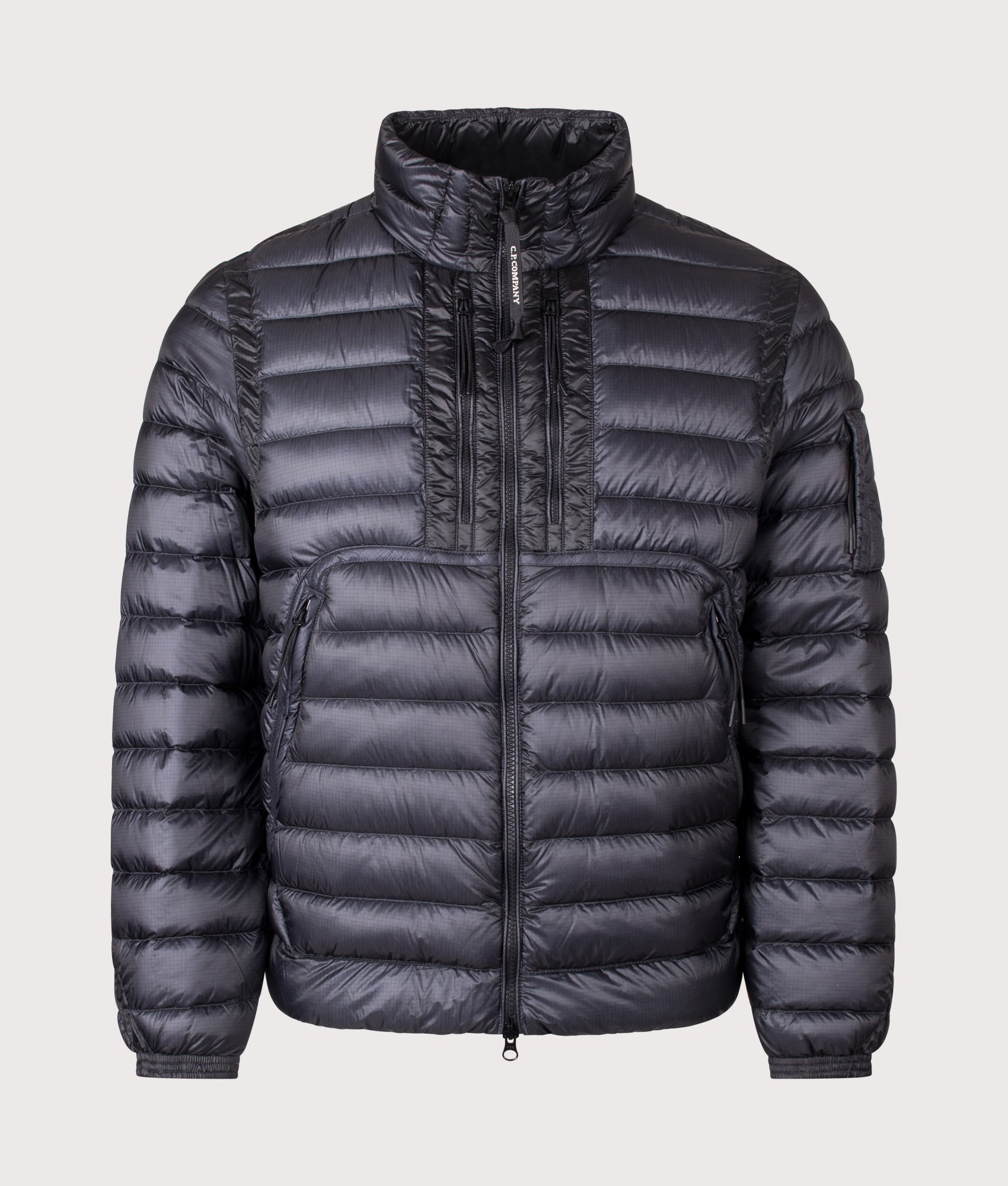 C.P. Company D.D. Shell Lens Down Jacket in Black at EQVVS Menswear. Front shot.