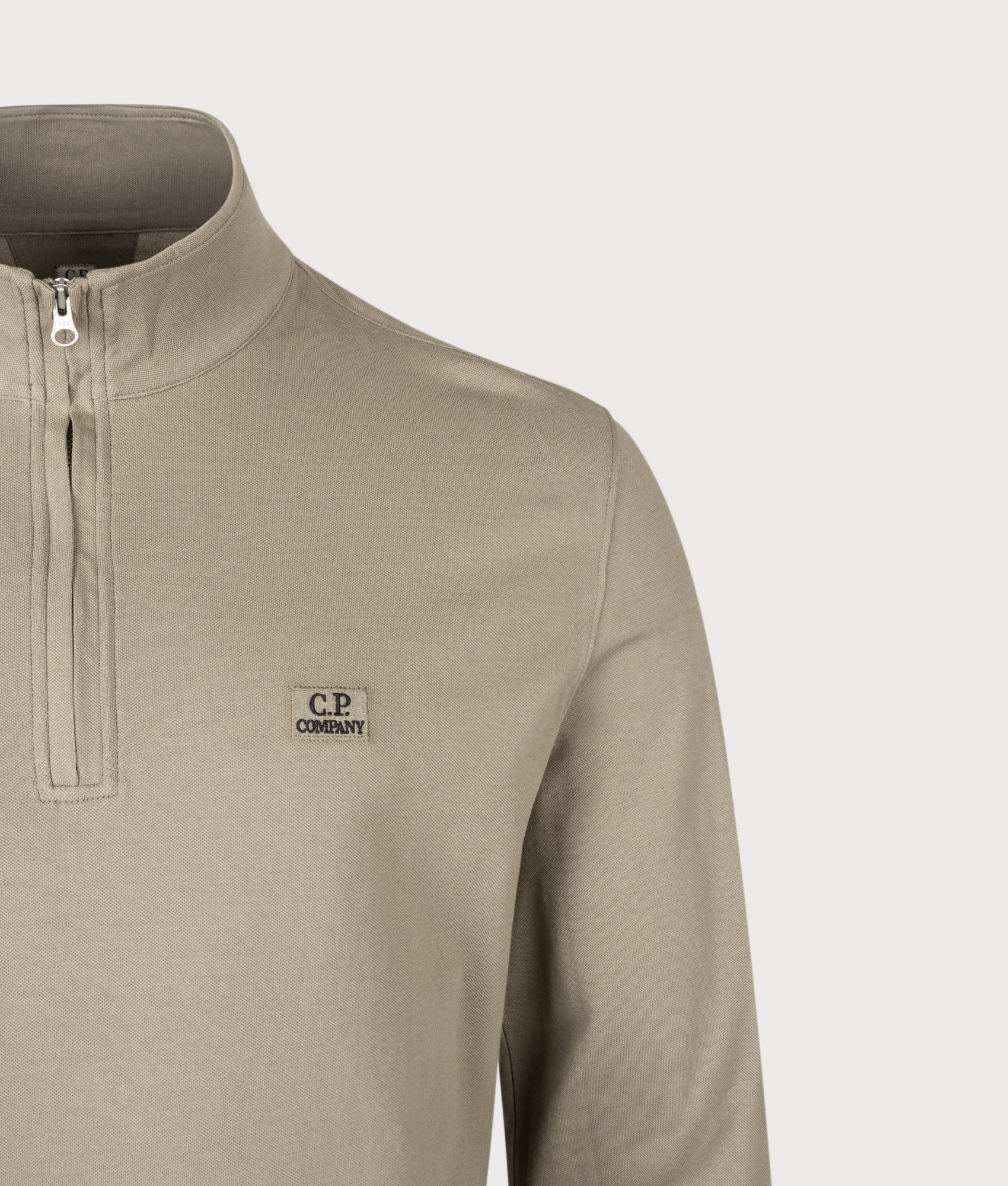 C.P. Company Stretch Piquet Quarter Zip Sweatshirt in Fallen Rock at EQVVS Menswear. Detail shot.