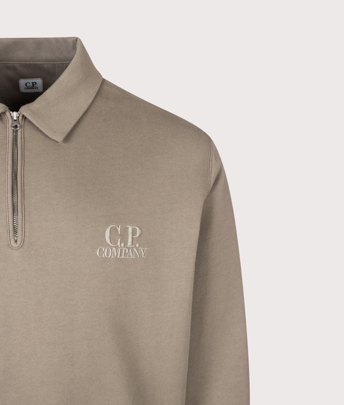 C.P. Company Diagonal Raised Fleece Polo Collar Sweatshirt in Fallen Rock at EQVVS Menswear. Detail shot.