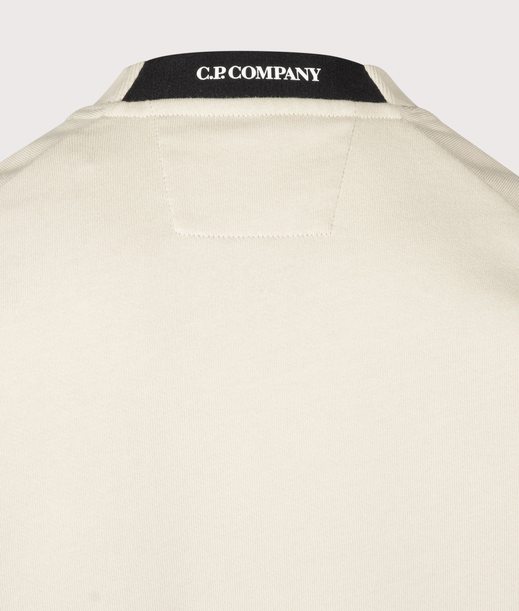 C.P. Company Diagonal Raised Fleece Crewneck Lens Sweatshirt in Silver Birch at EQVVS Menswear. Back detail shot.