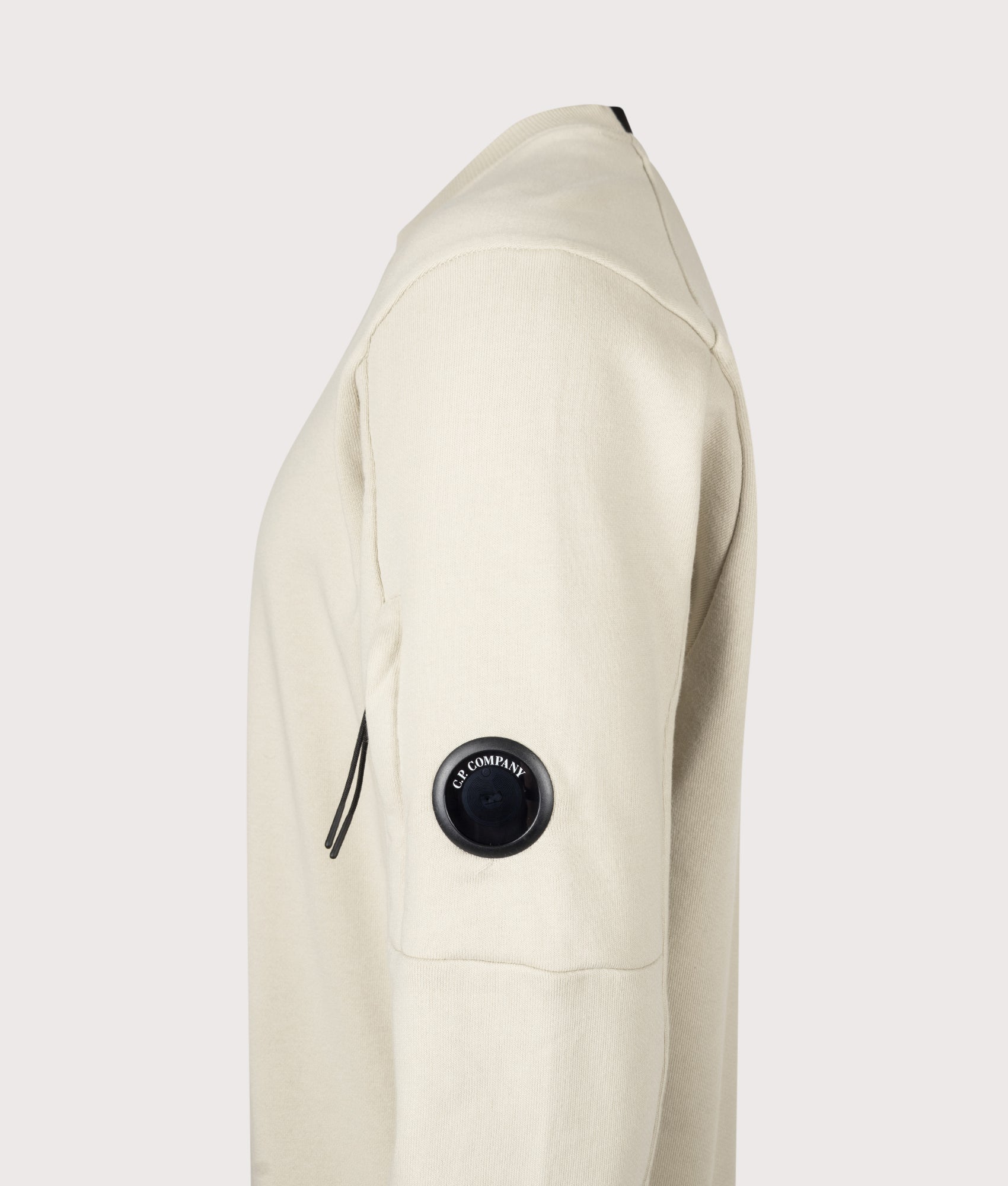 C.P. Company Diagonal Raised Fleece Crewneck Lens Sweatshirt in Silver Birch at EQVVS Menswear. Detail shot.