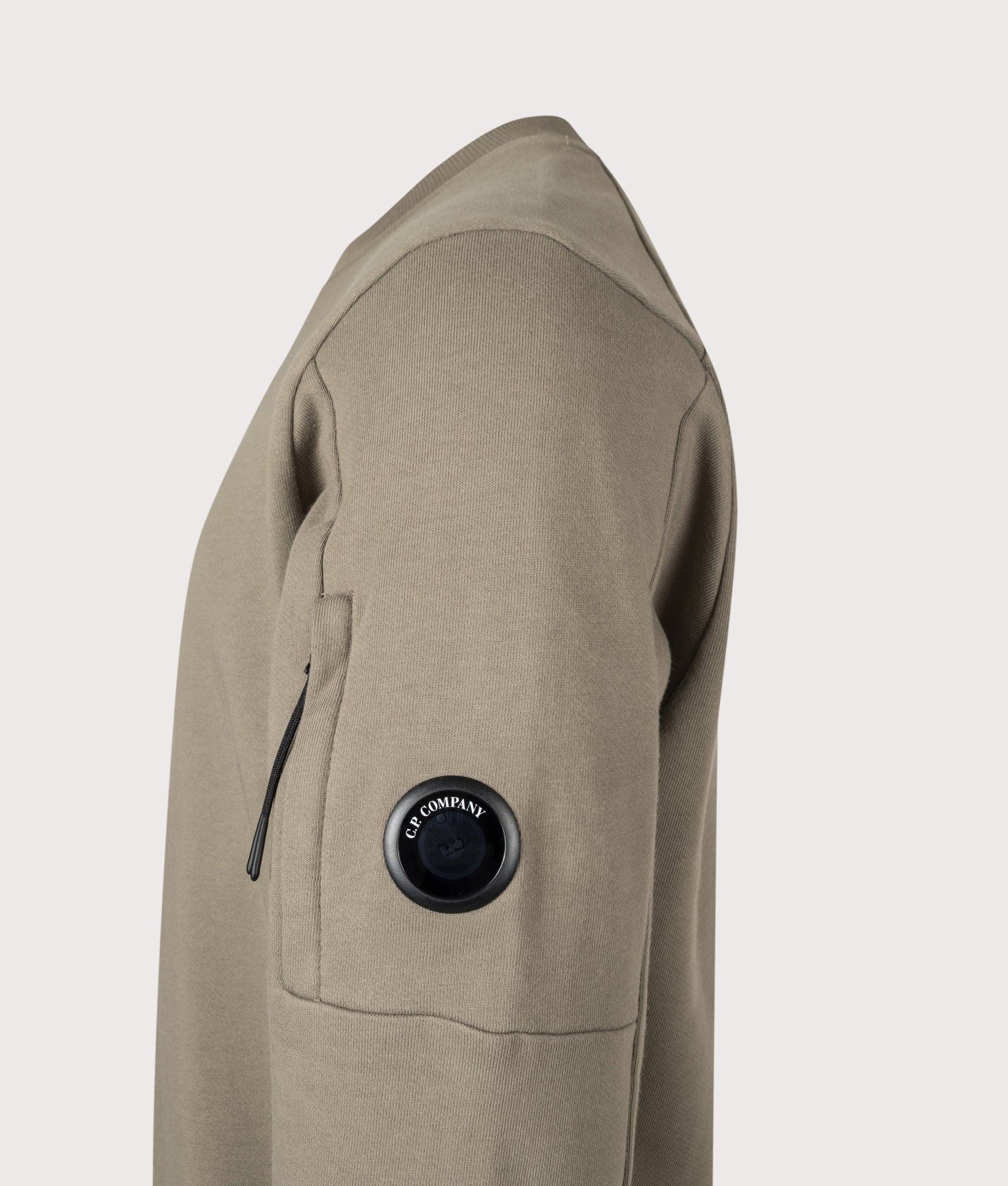 C.P. Company Diagonal Raised Fleece Crewneck Lens Sweatshirt in Fallen Rock at EQVVS Menswear. Detail shot.