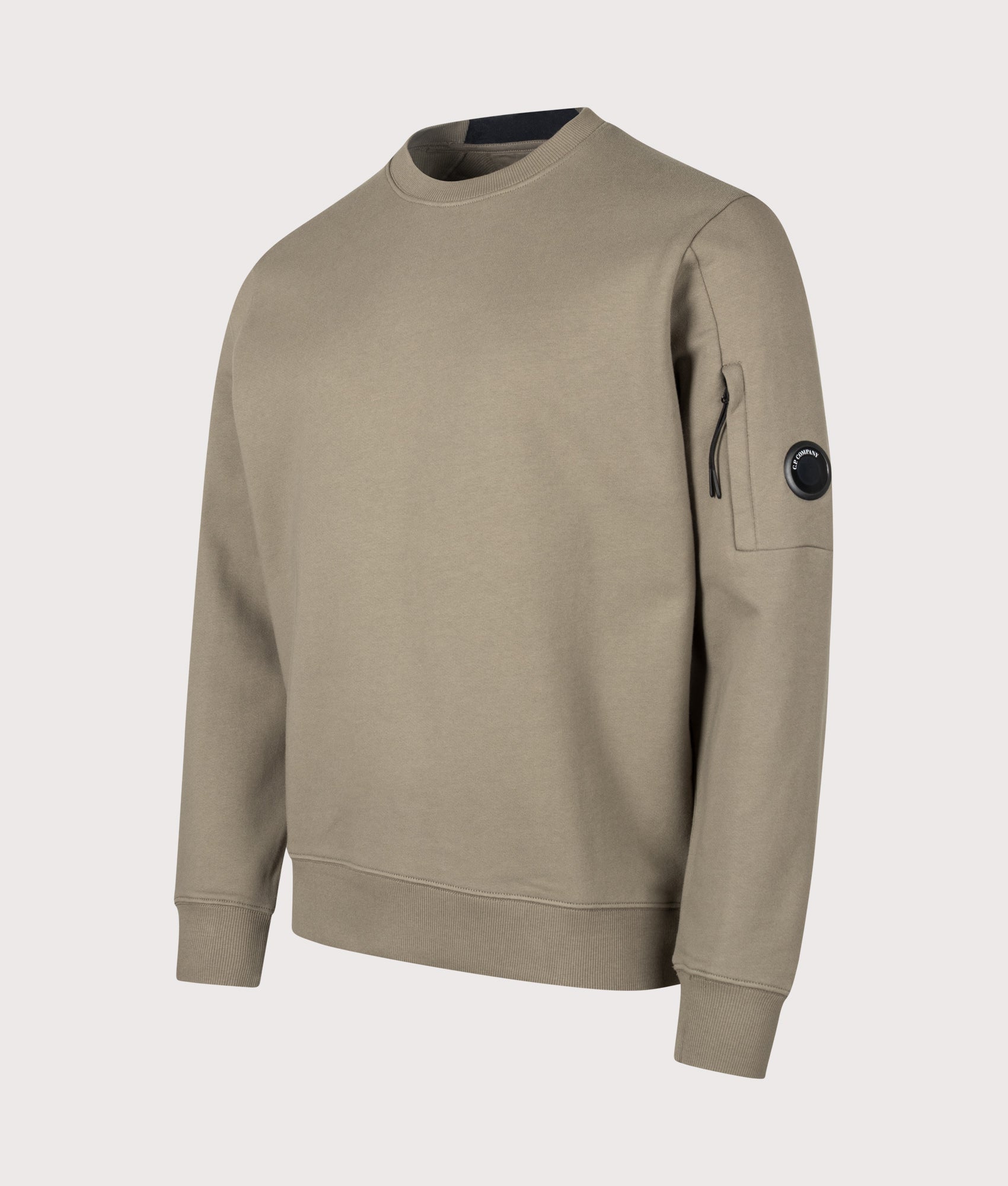 C.P. Company Diagonal Raised Fleece Crewneck Lens Sweatshirt in Fallen Rock at EQVVS Menswear. Angled front shot.