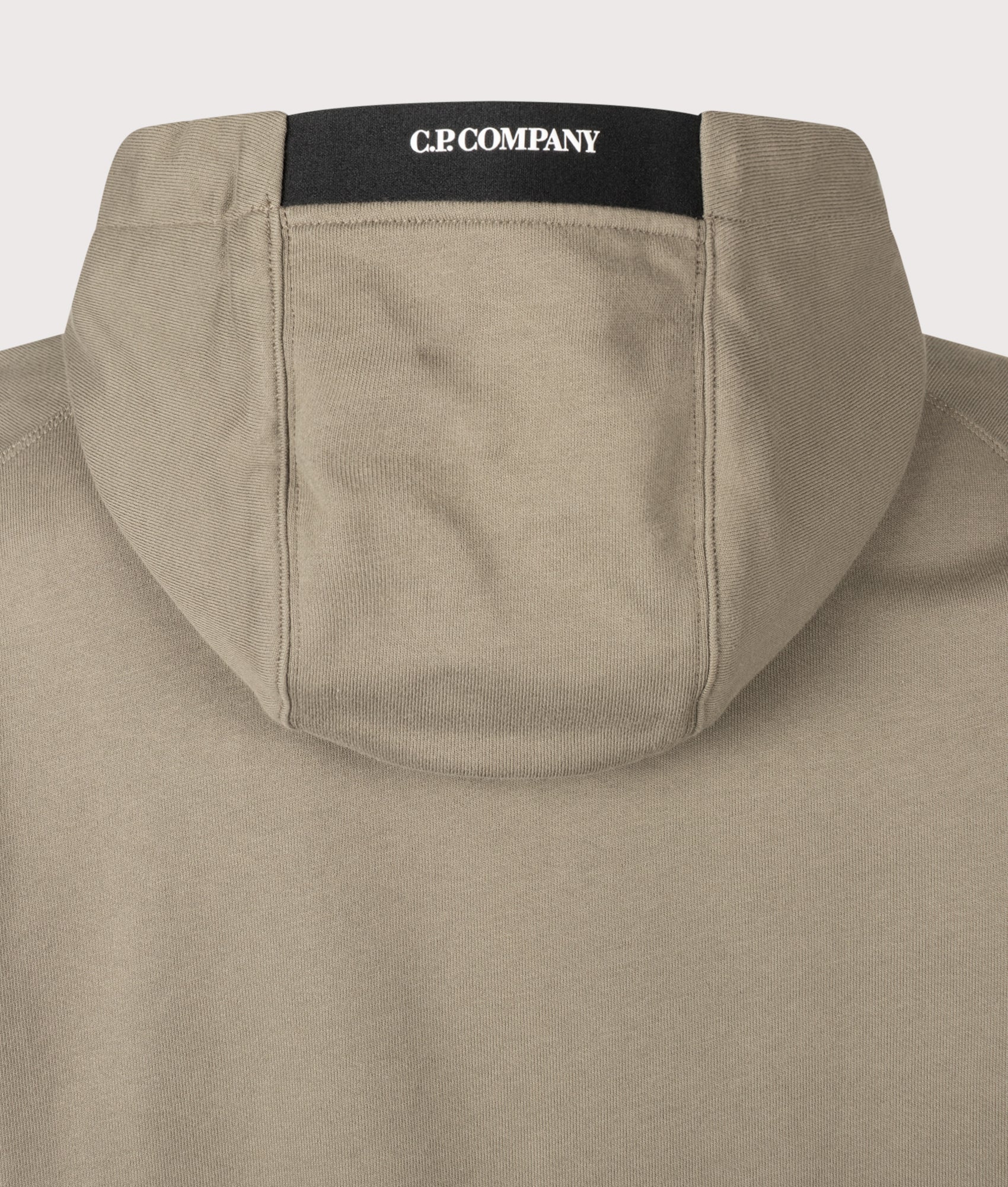 C.P. Company Diagonal Raised Fleece Hoodie in Fallen Rock at EQVVS Menswear. Hood detail shot.