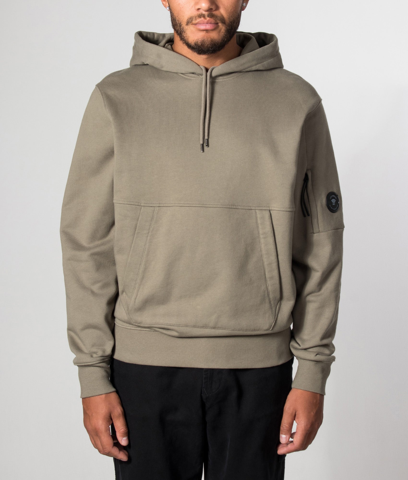 C.P. Company Diagonal Raised Fleece Hoodie in Fallen Rock at EQVVS Menswear. Model front shot.