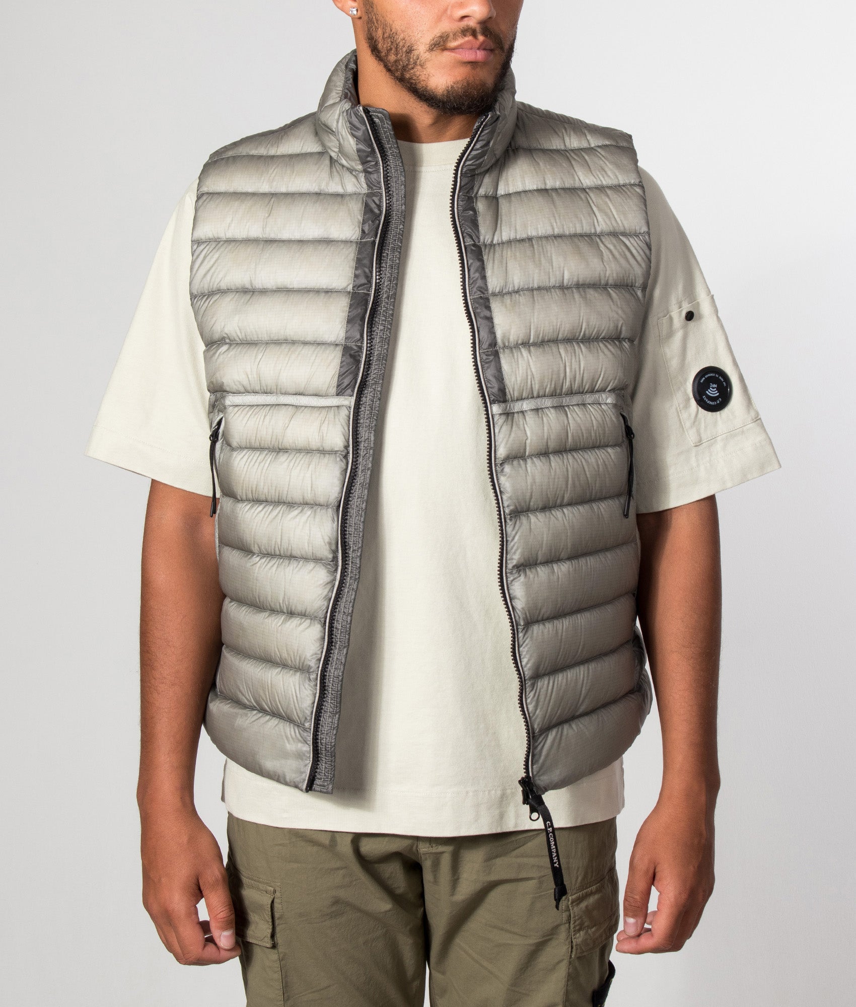 C.P. Company D.D. Shell Down Gilet in Flint Grey at EQVVS Menswear. Model front shot.