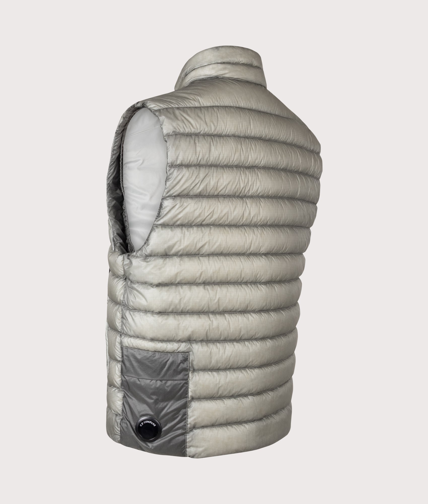 C.P. Company D.D. Shell Down Gilet in Flint Grey at EQVVS Menswear. Angled back shot.