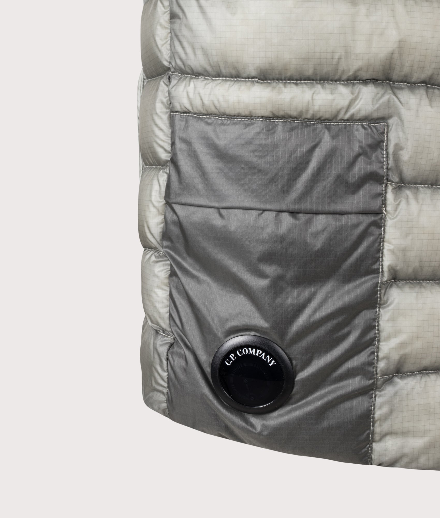 C.P. Company D.D. Shell Down Gilet in Flint Grey at EQVVS Menswear. Detail shot.