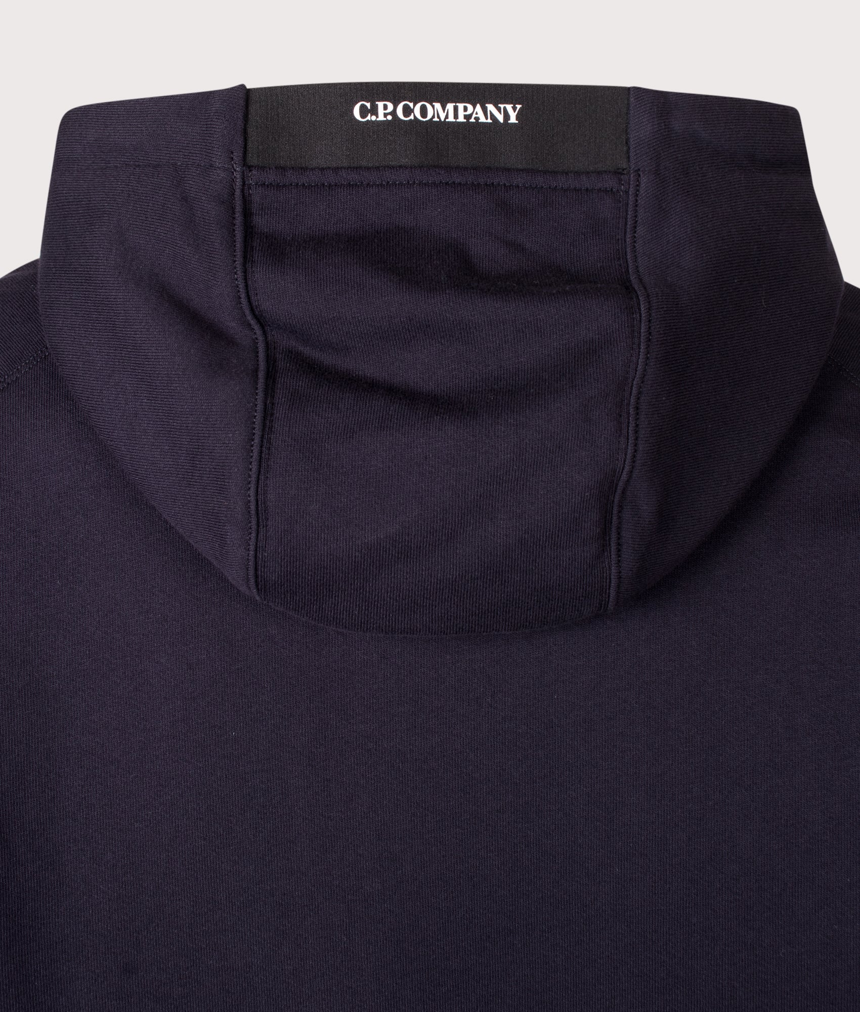 C.P. Company Diagonal Raised Fleece Hoodie in Total Eclipse at EQVVS Menswear. Hood detail shot.