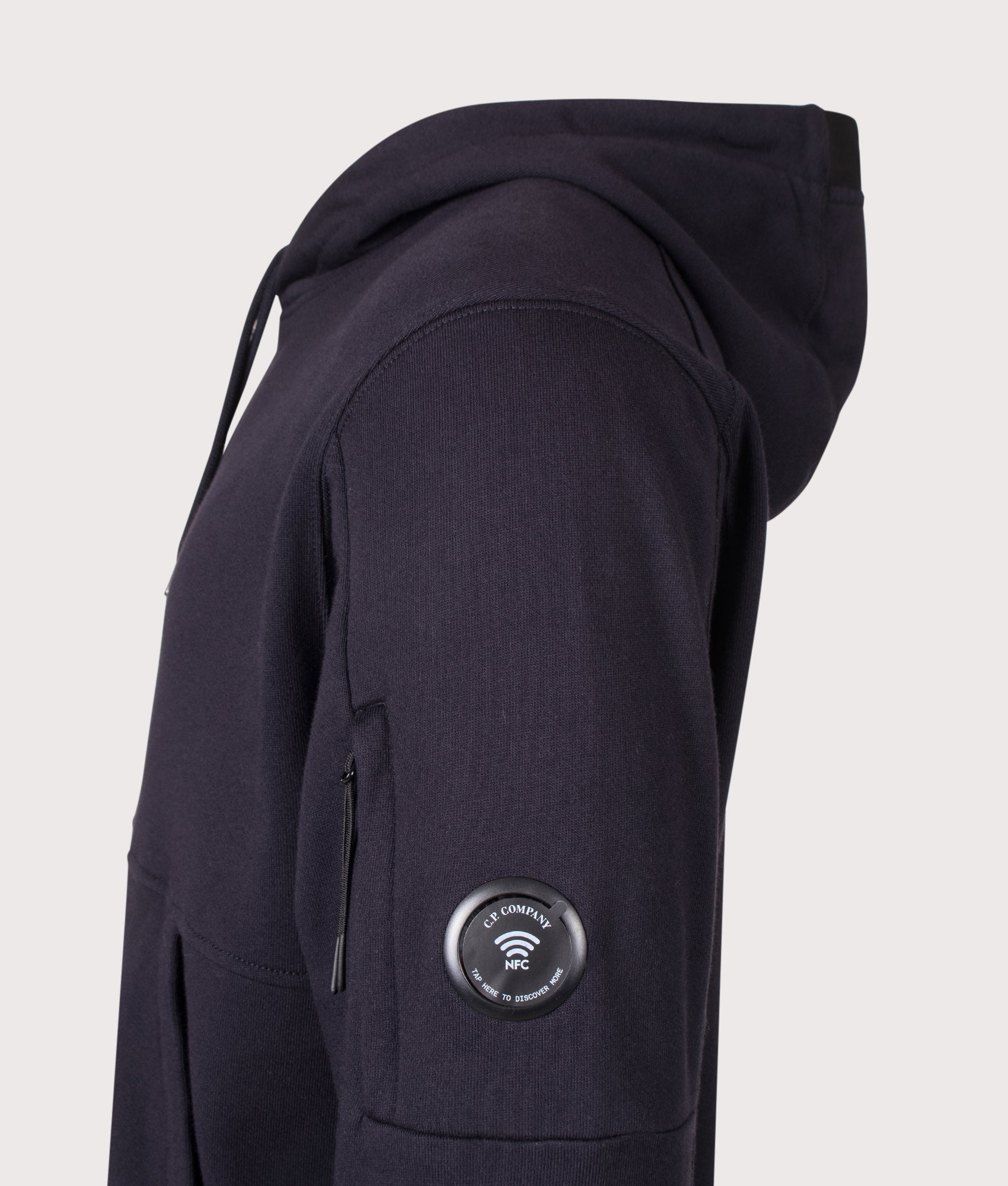 C.P. Company Diagonal Raised Fleece Hoodie in Total Eclipse at EQVVS Menswear. NFC detail shot.