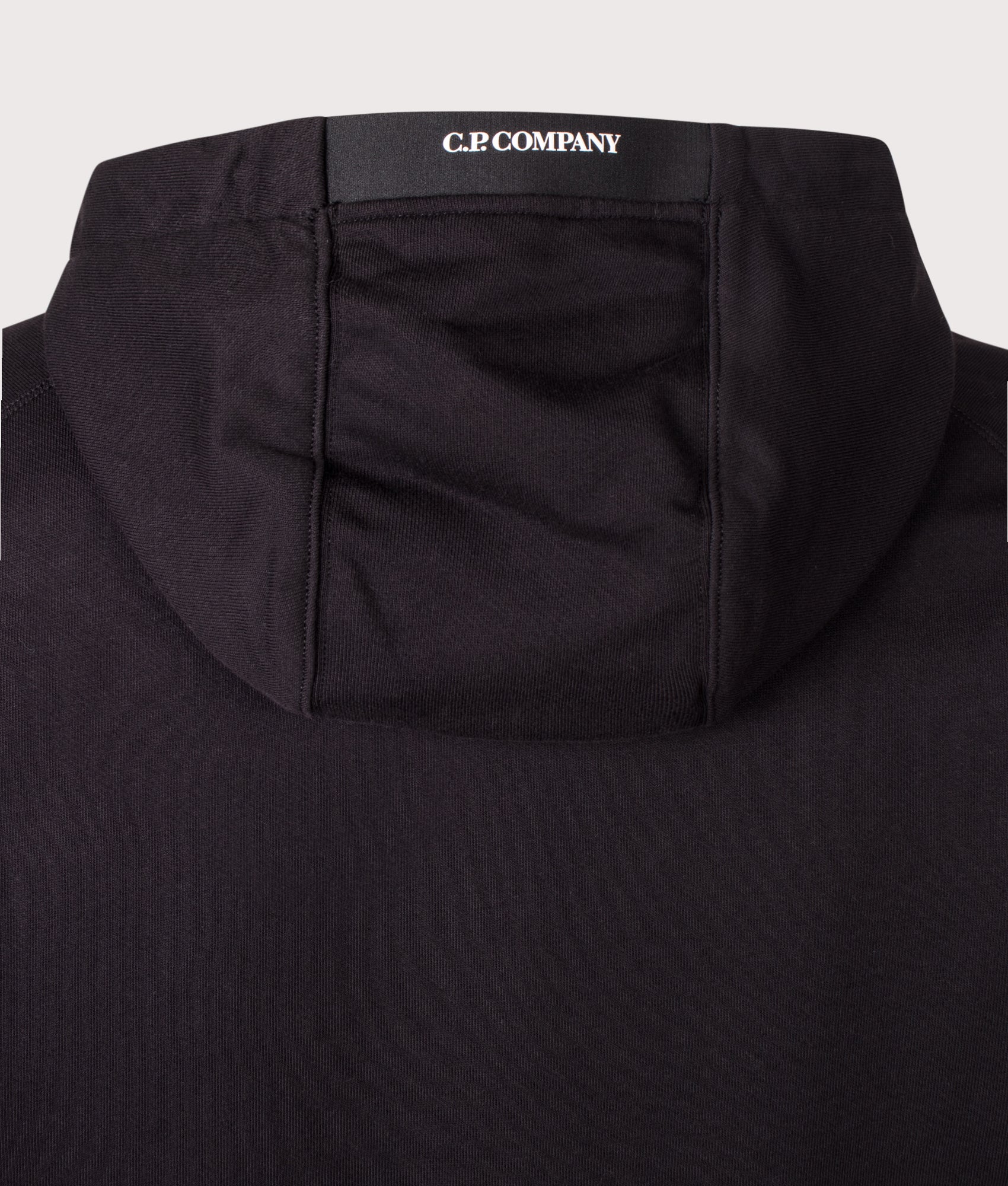 C.P. Company Diagonal Raised Fleece Hoodie in Black at EQVVS Menswear. Hood detail shot.