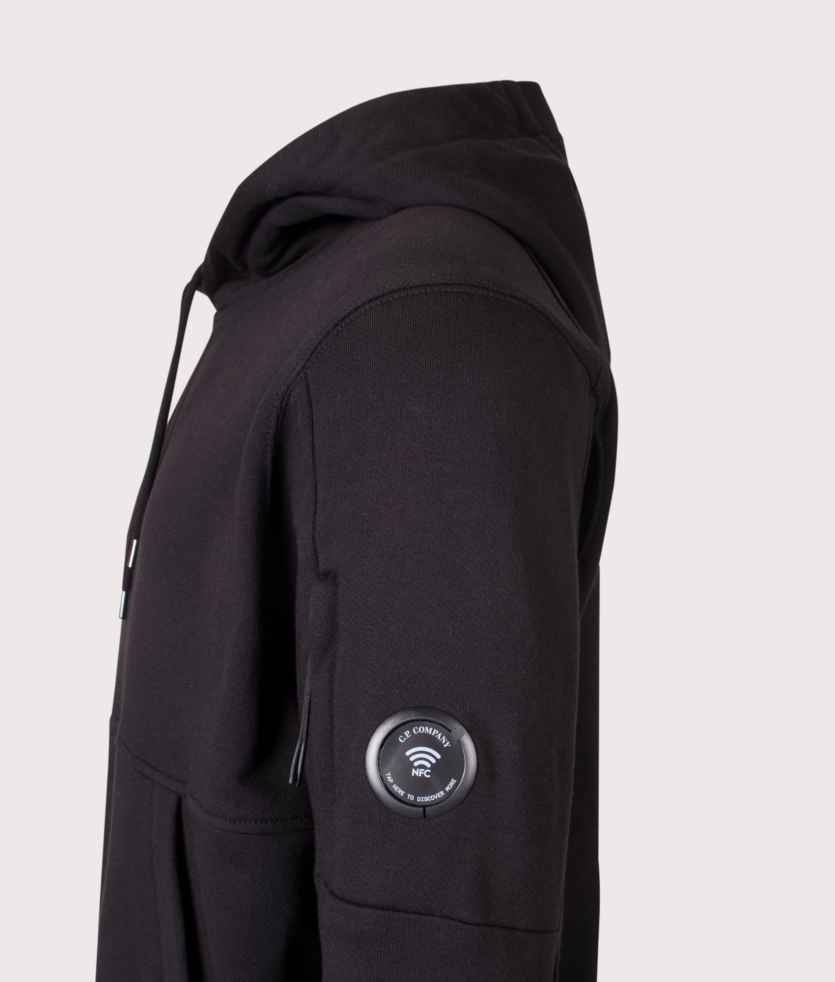 C.P. Company Diagonal Raised Fleece Hoodie in Black at EQVVS Menswear. NFC detail shot.